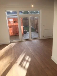 Living room with glazed doors to the garden at Pershore Close