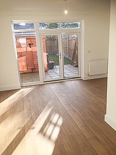 Sunlit living area opening onto the garden at Pershore Close