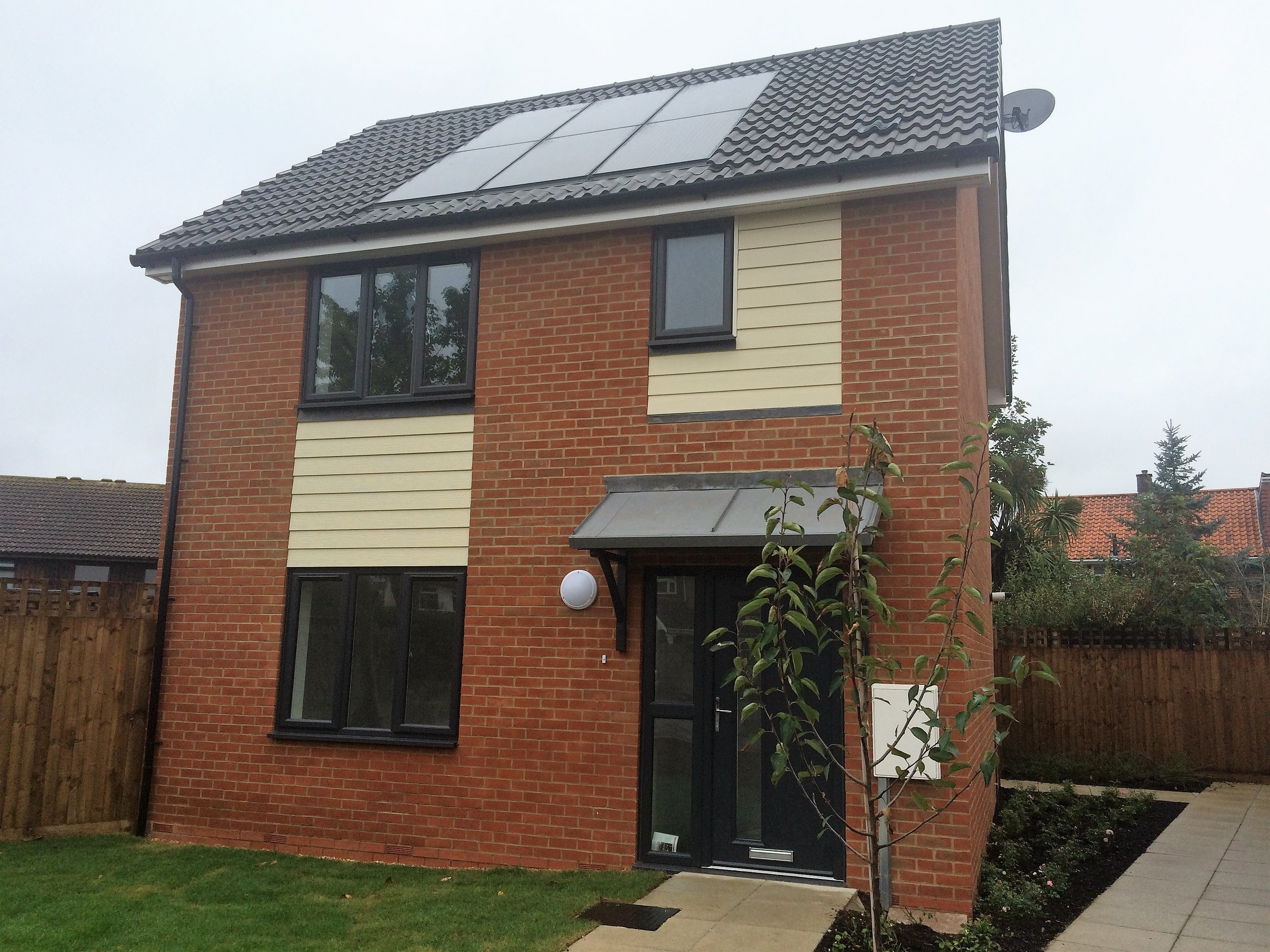 Detached brick home with roof-mounted solar panels at Northdown Gardens Phase 2