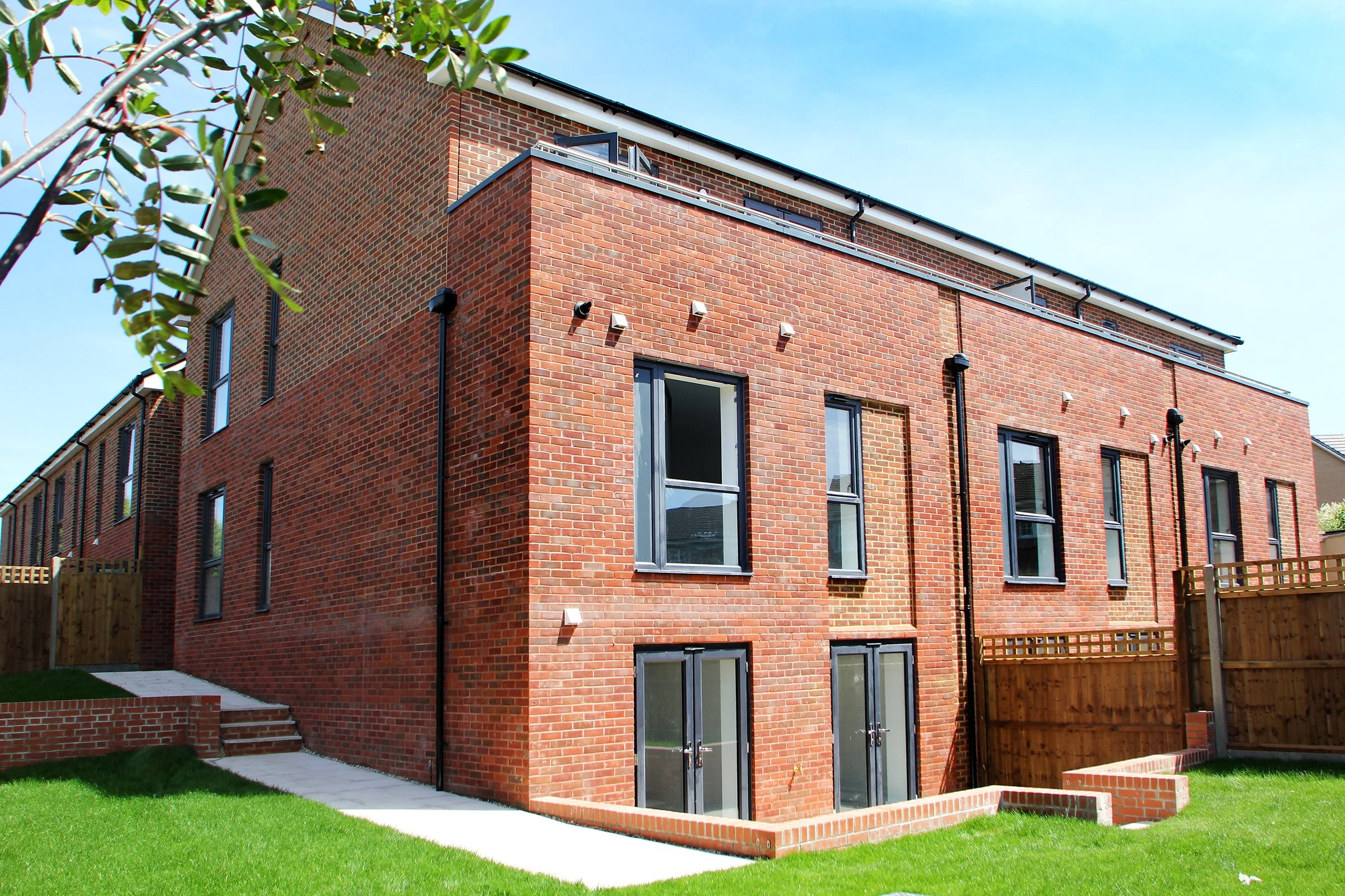 Rear elevation and landscaped garden at Coppice Path