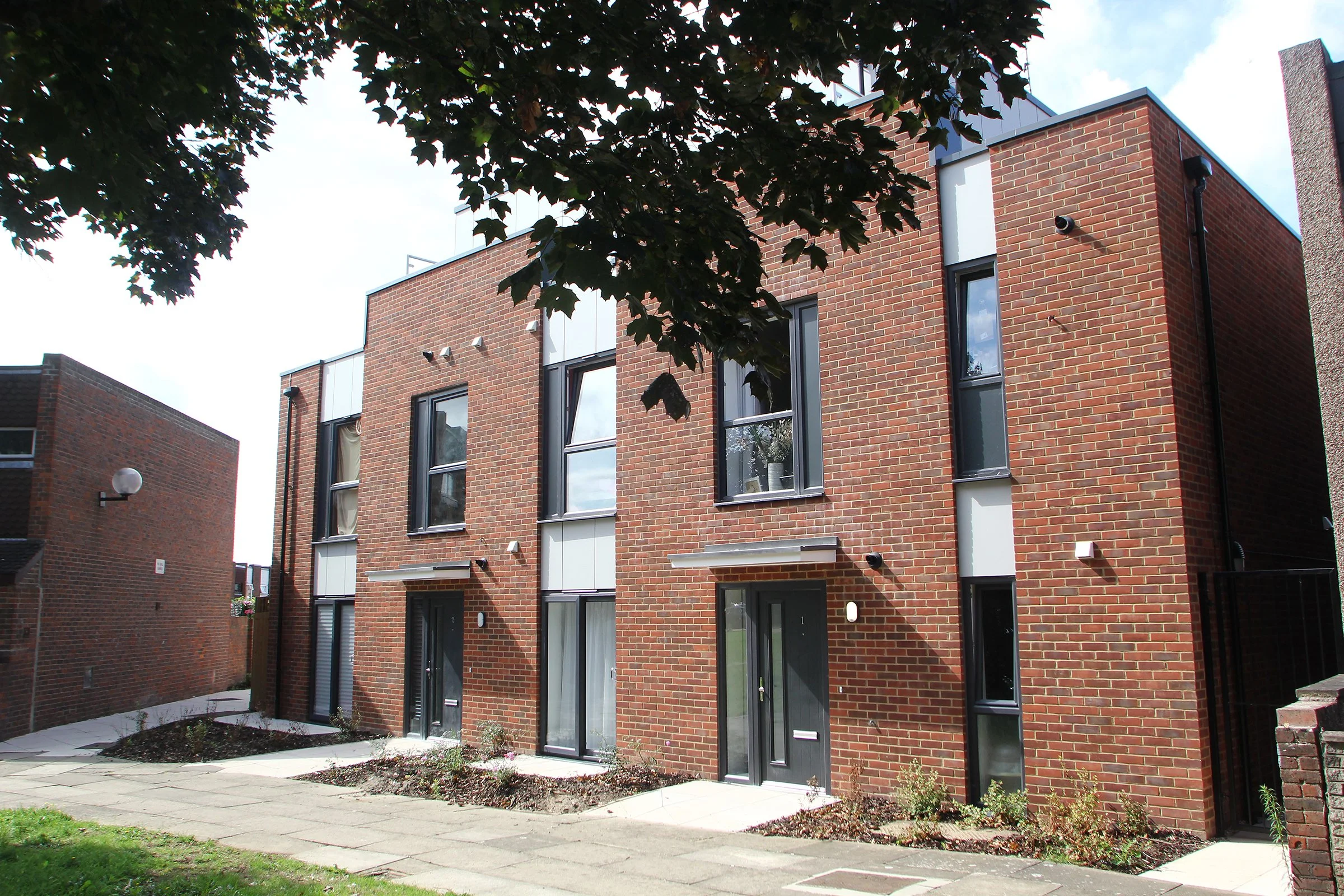 Brick and metal-clad exterior of Stanway House