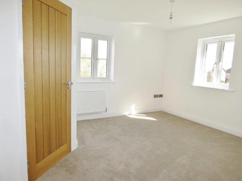 Bright carpeted bedroom at Edward Marks Drive