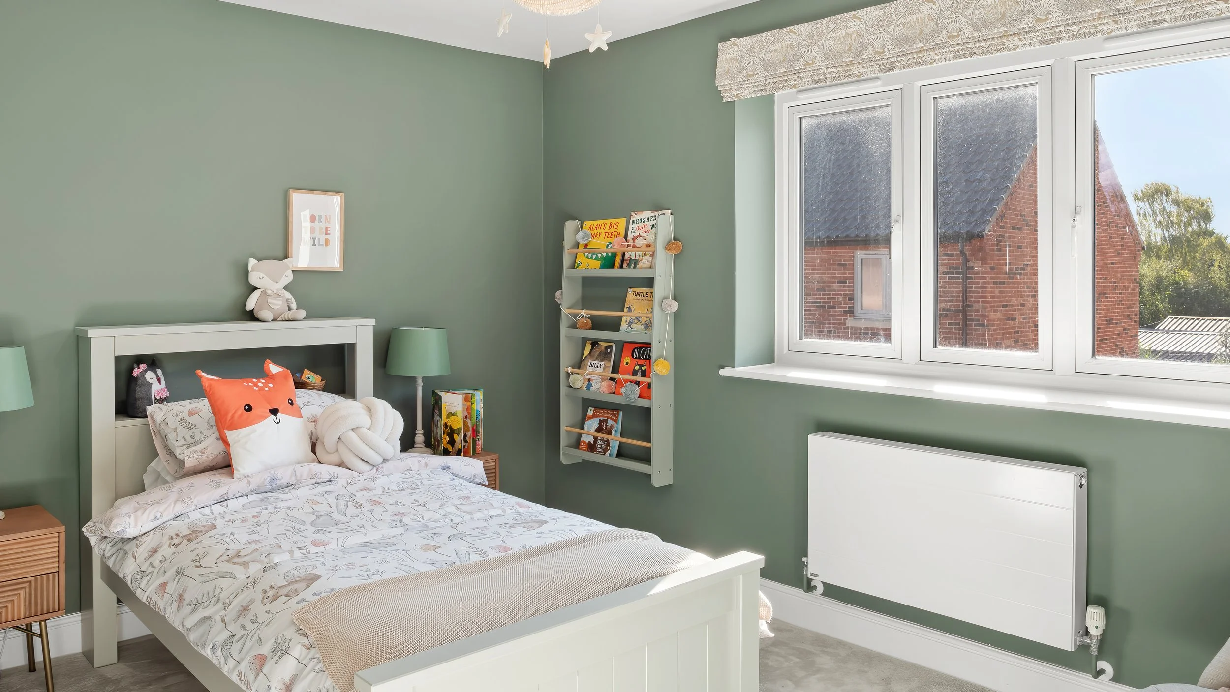 Furnished bedroom with green walls at The Green