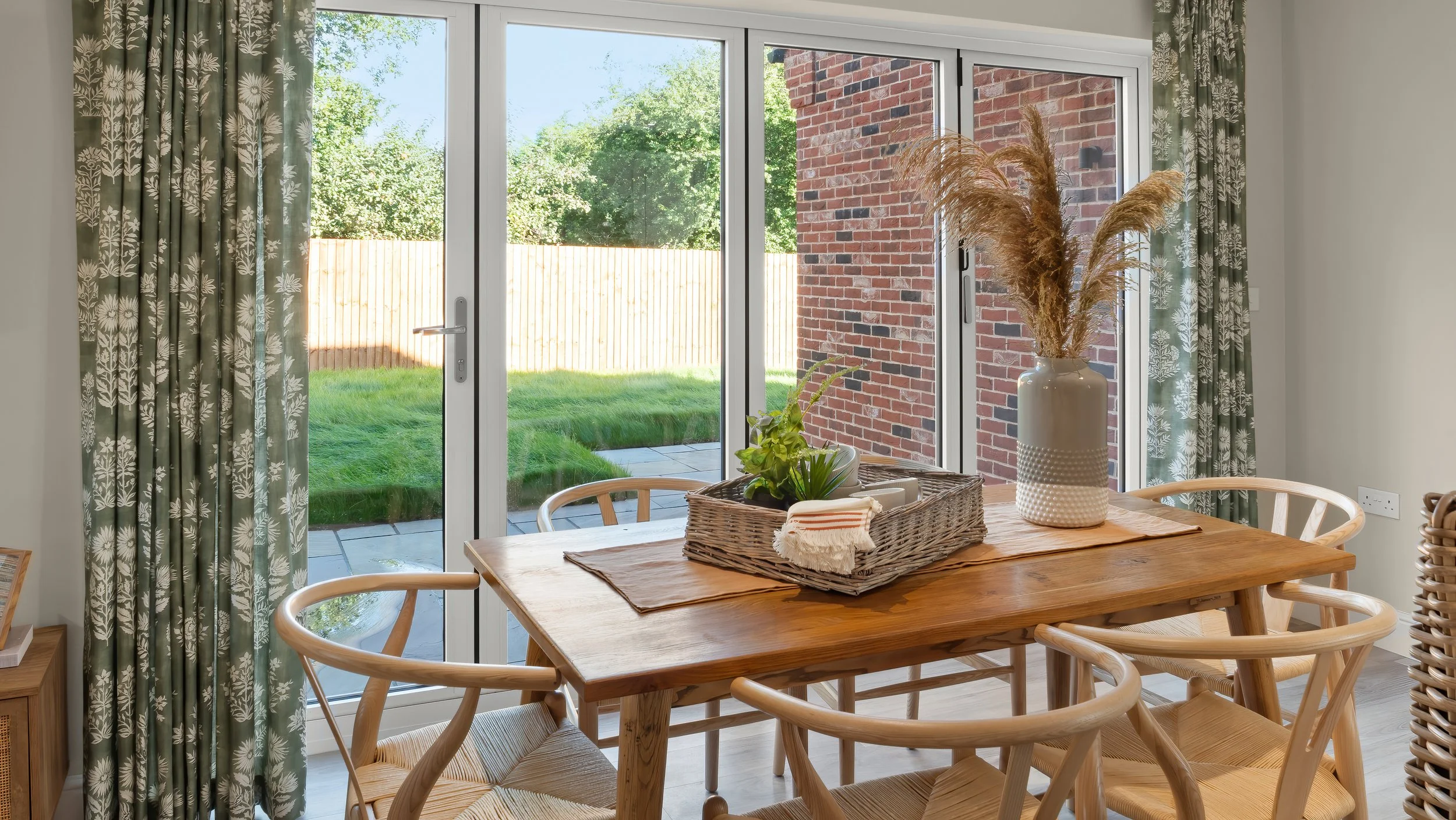 Dining table beside garden doors at The Green