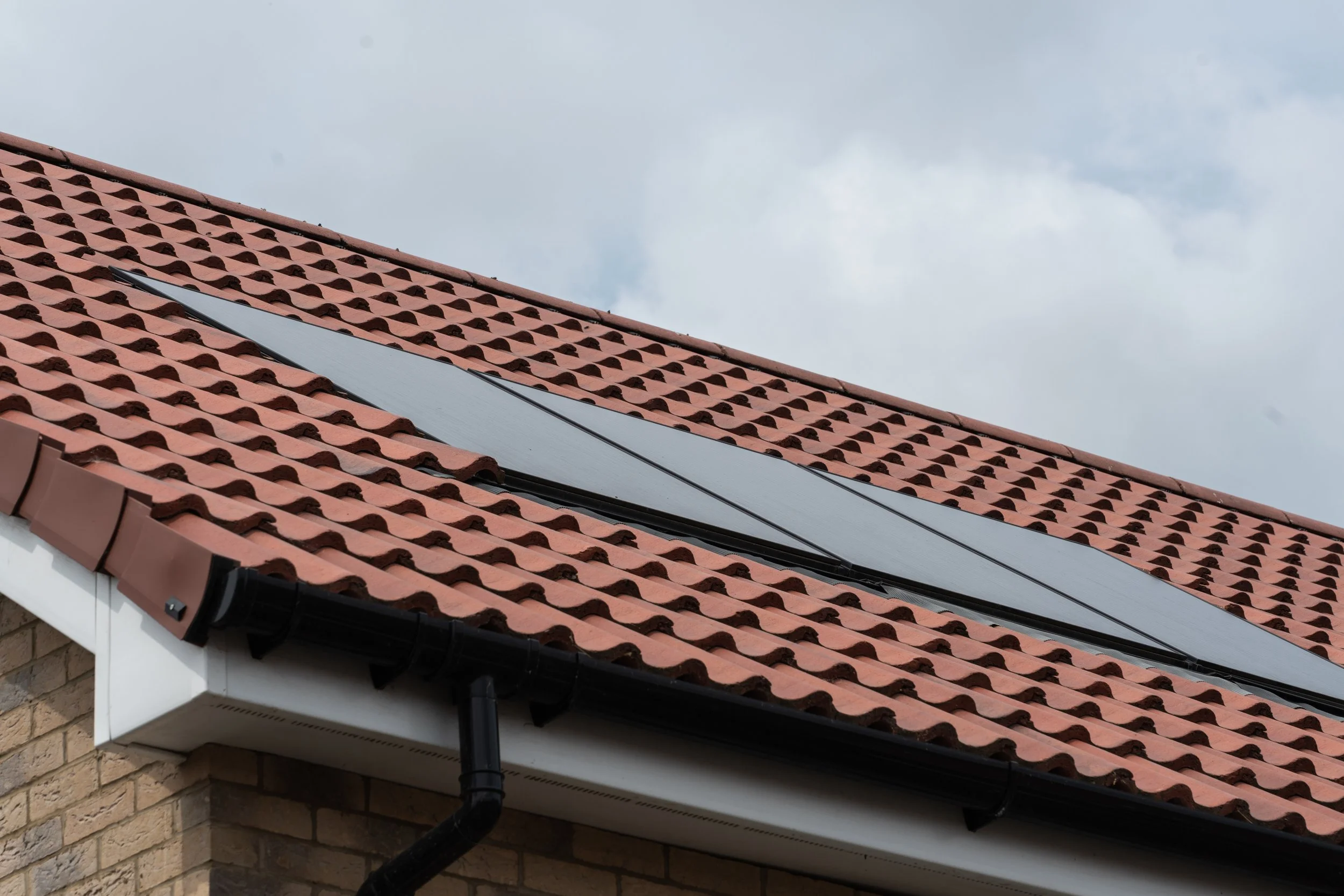 Solar panels on a tiled roof at Gowers Place