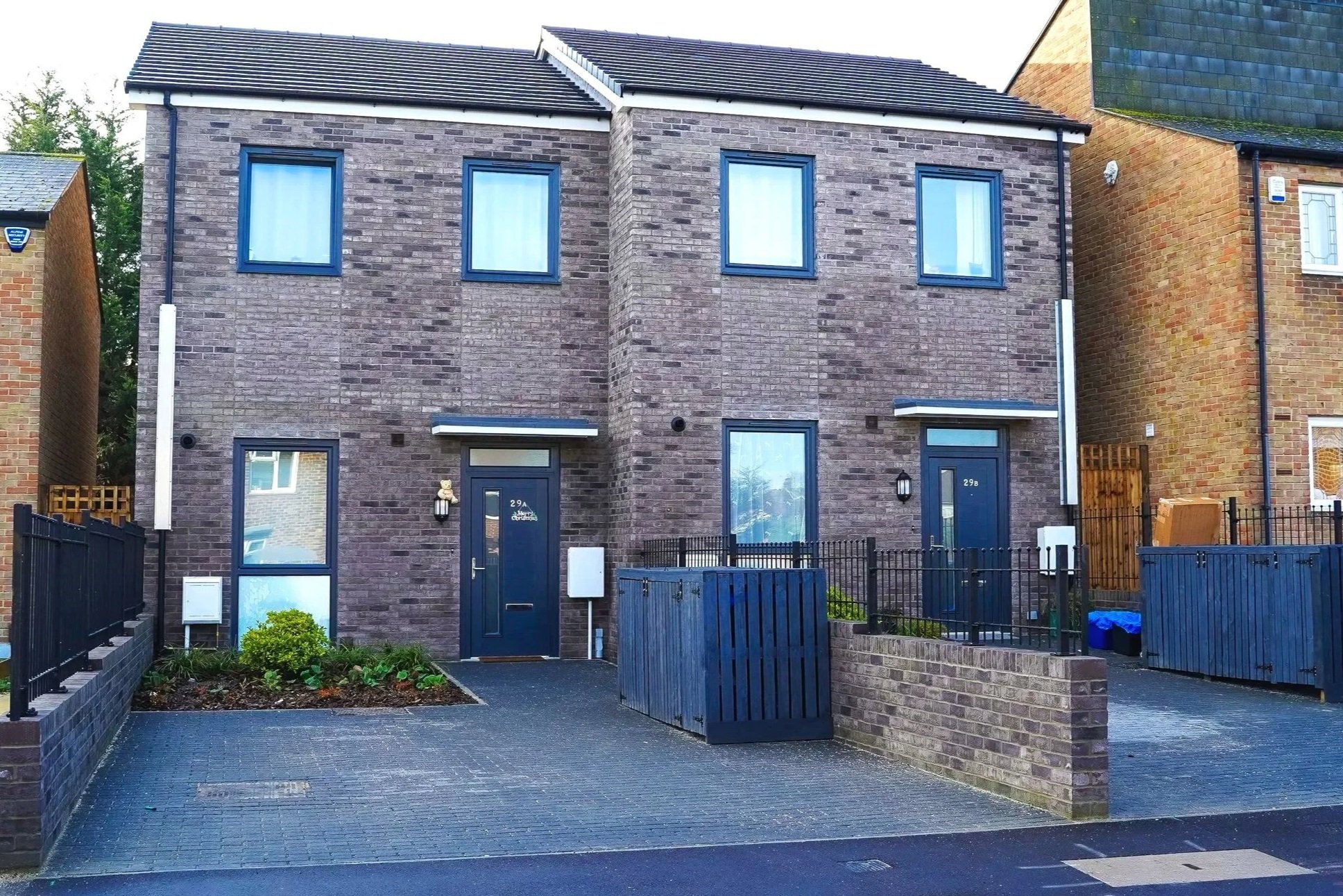 Pair of modern brick-built homes with private driveways at Pershore Close