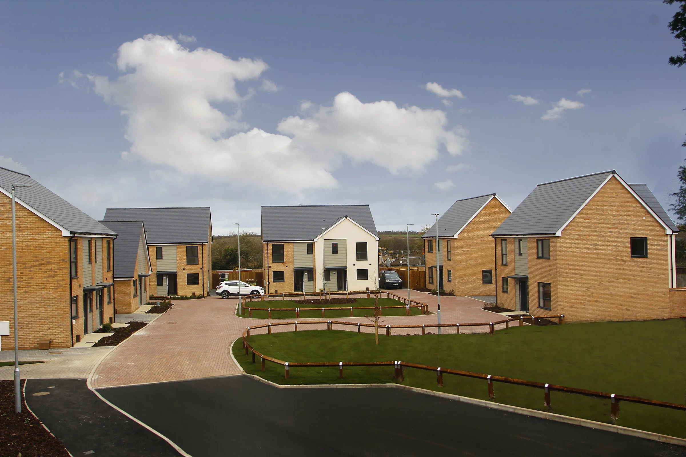 New homes arranged around a landscaped green at Needingworth