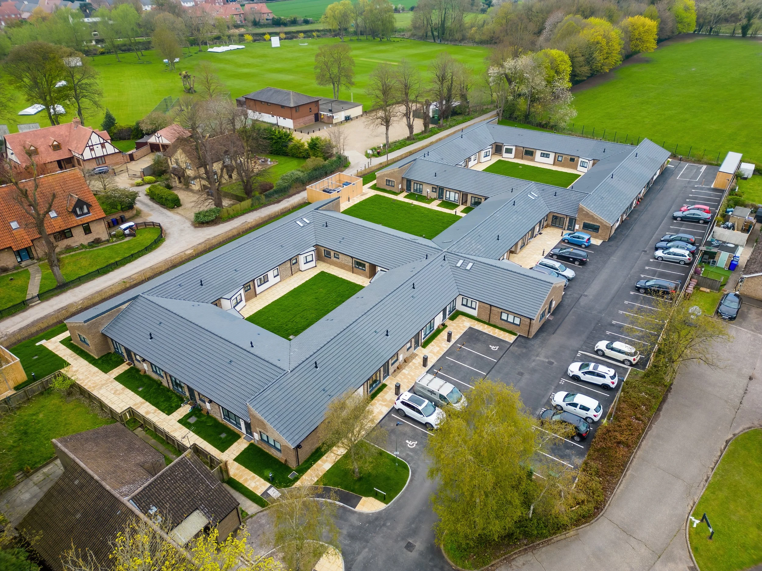 Aerial view of Wamil Court homes arranged around landscaped courtyards