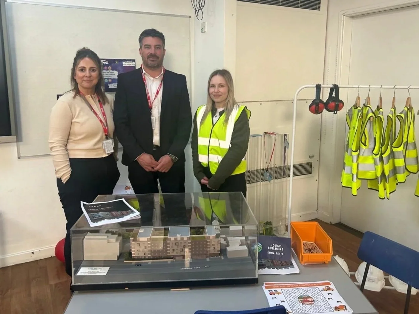 Aspen Build representatives at Mundesley Junior School Careers Day with a construction model