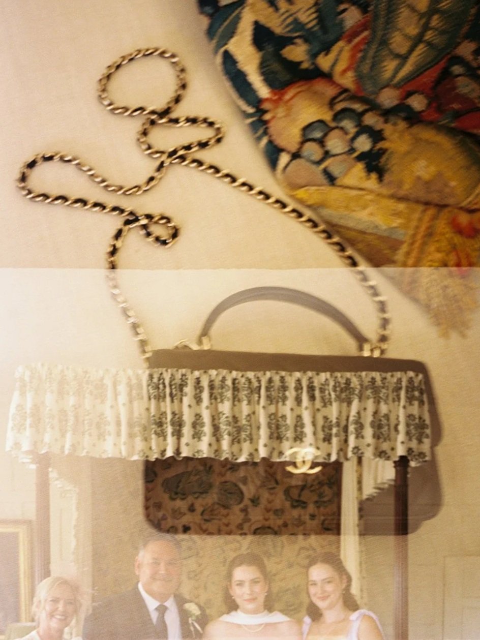 A double exposure photo with a jewelry chain on a table at the top and a framed picture of four people at a formal event, with a decorative canopy overhead.