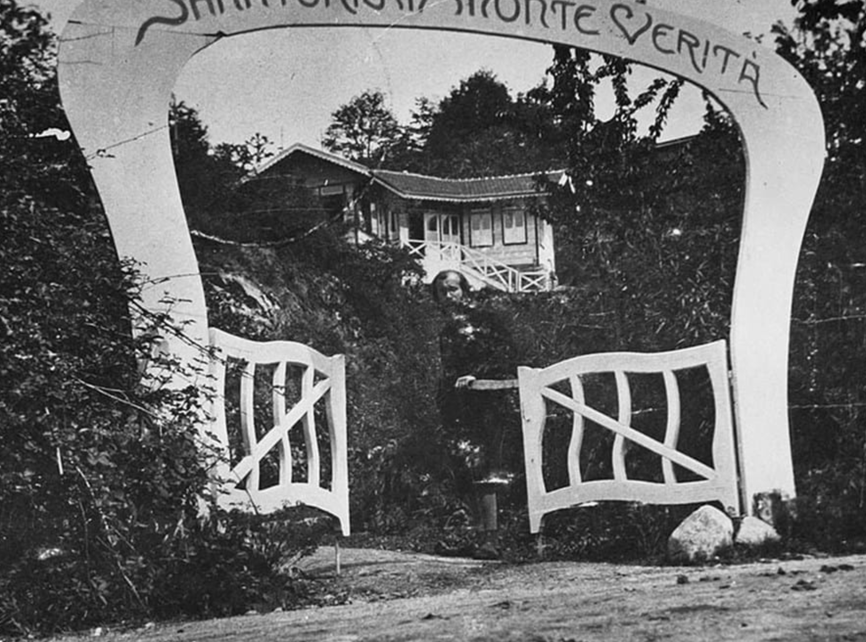 The entrance gate to Monte Verità, in Ascona, Switzerland, circa 1907. It reads "Sanatorium Monte Verità".