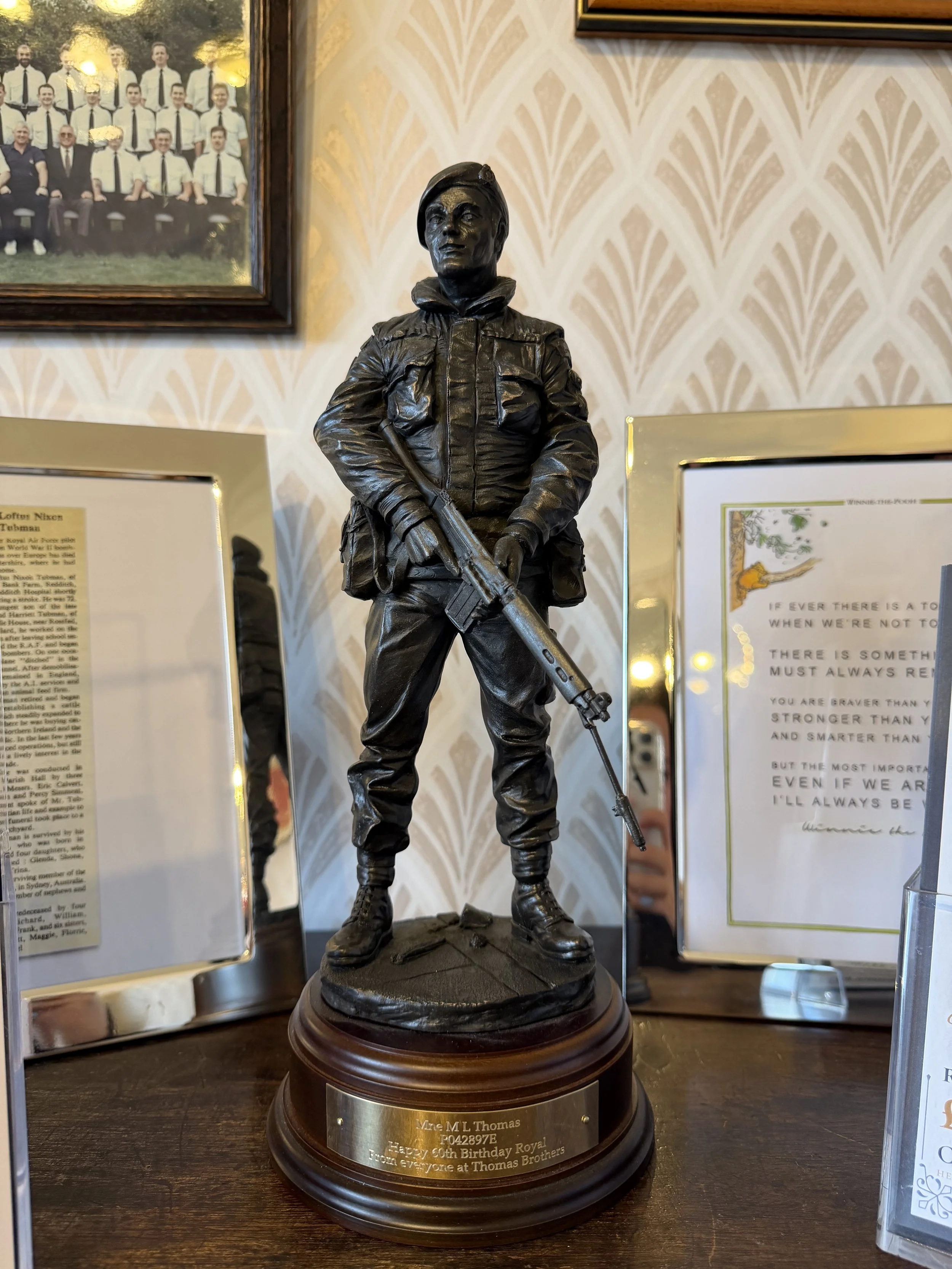 Bronze memorial statue of a young soldier in military uniform. Thomas Brothers The Funeral Directors legacy
