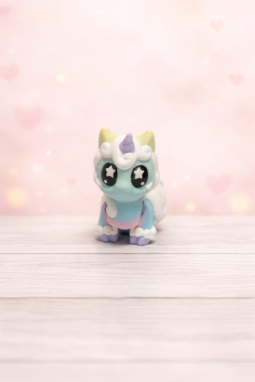 Pastel unicorn figurine on wood.png