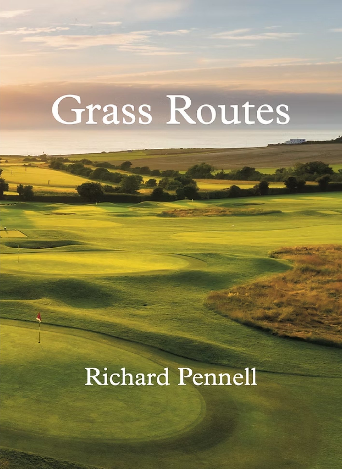 Cover of a book titled 'Grass Routes' with a landscape view of a golf course, rolling hills, and a sunset sky.