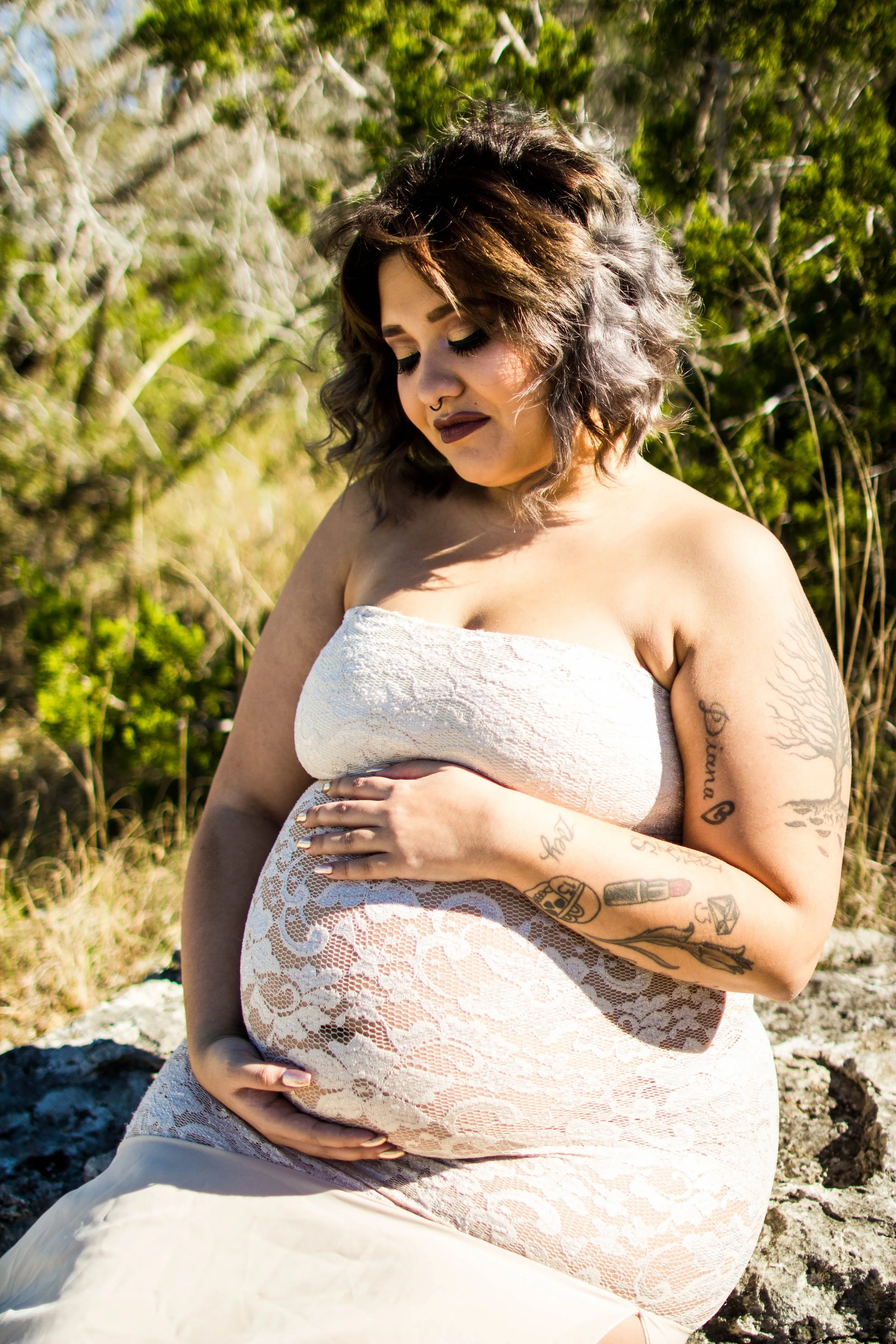 Outdoor maternity portrait of an expecting mother celebrating pregnancy during a natural maternity photography session in Austin, Texas by Caerus Multimedia.
