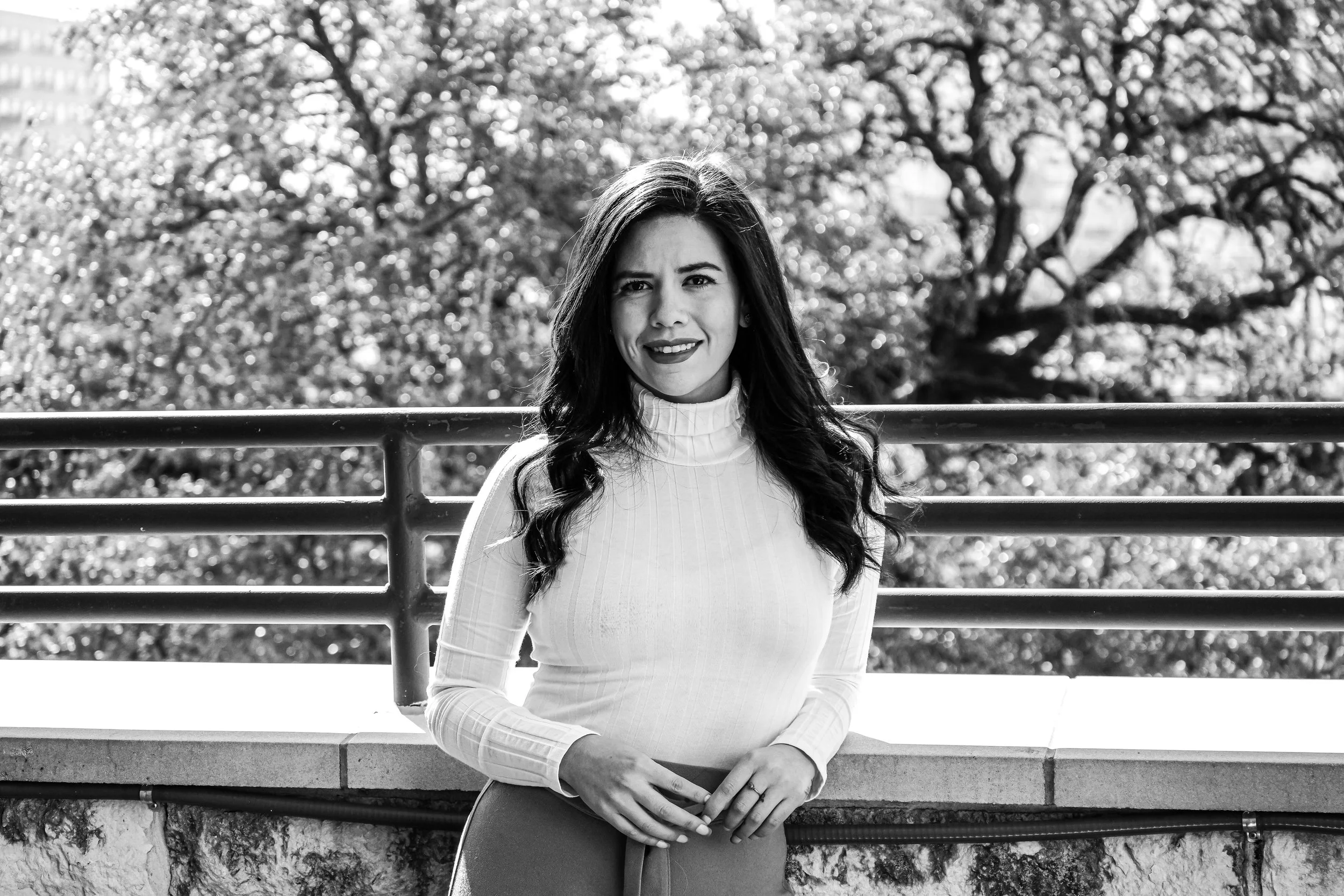 A timeless black and white portrait highlighting expression, contrast, and natural light. The classic composition emphasizes personality and professionalism while creating a cinematic and elegant portrait style.