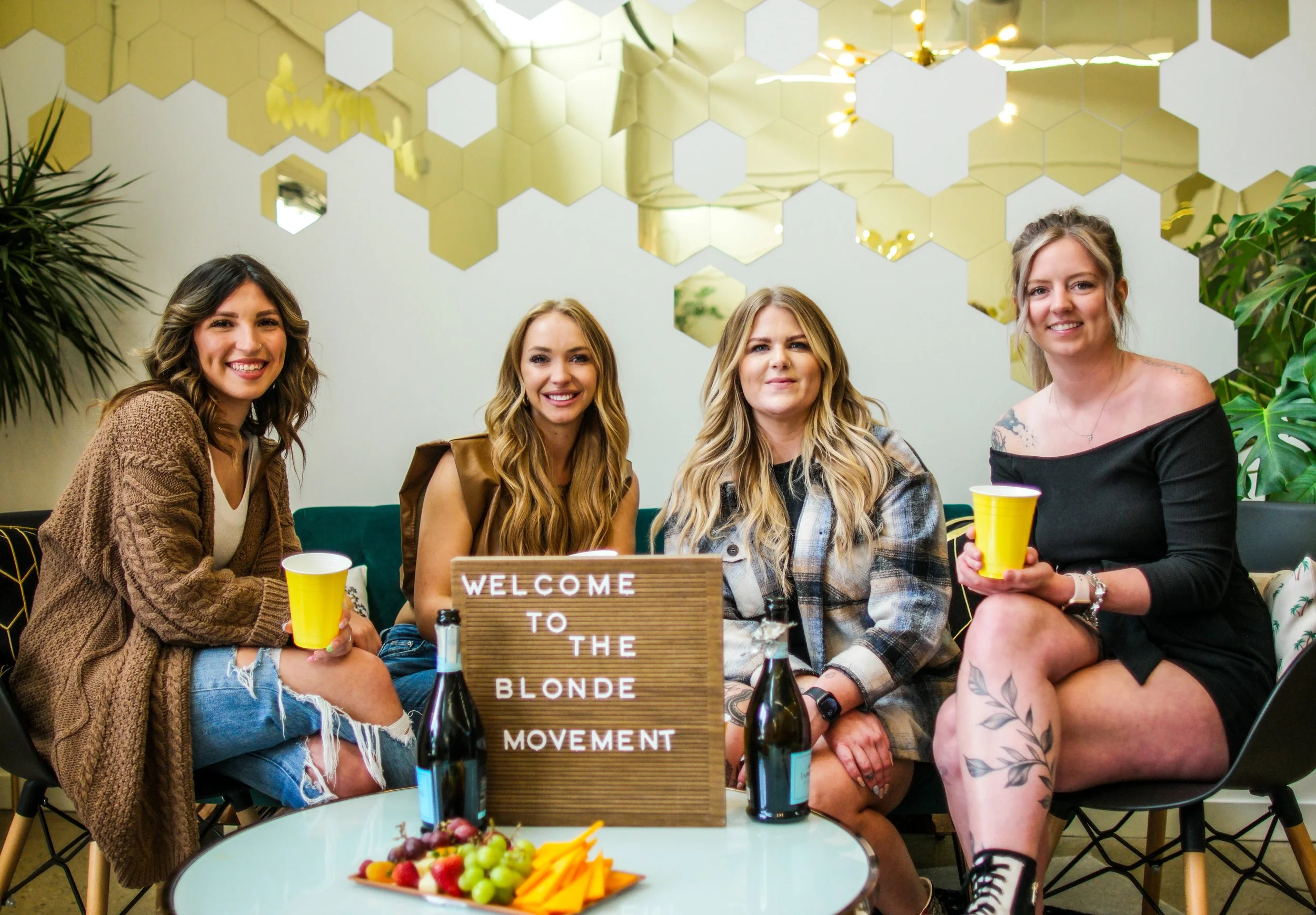 A vibrant lifestyle group portrait photographed during a social gathering in Austin. The energy of the moment — friends relaxing together, sharing drinks, and enjoying the atmosphere — creates a candid portrait that captures personality, connection, 