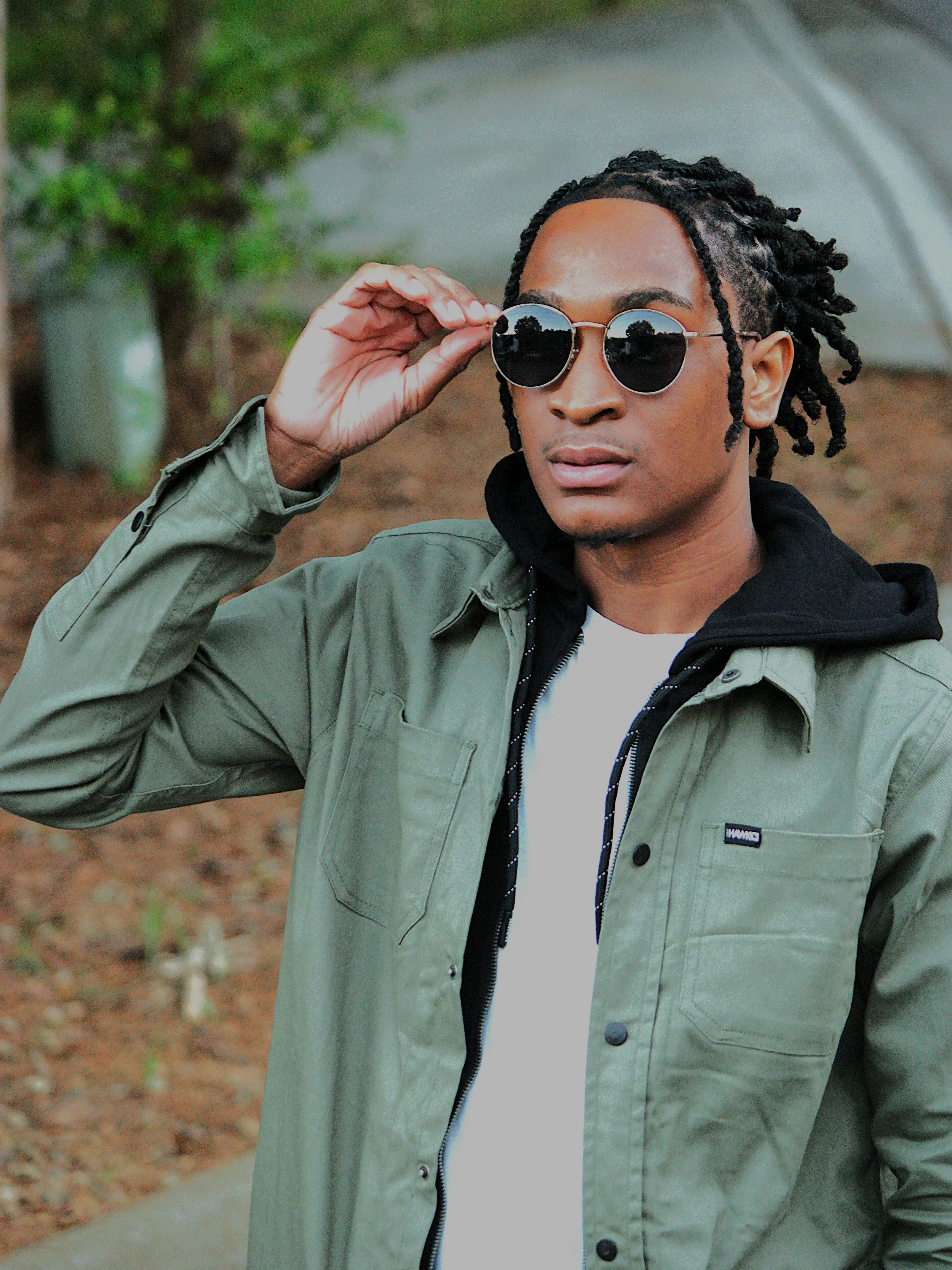 A modern portrait captured during an outdoor session in Atlanta, Georgia. The image highlights the subject’s confident style with soft natural lighting and a clean, lifestyle-inspired composition.