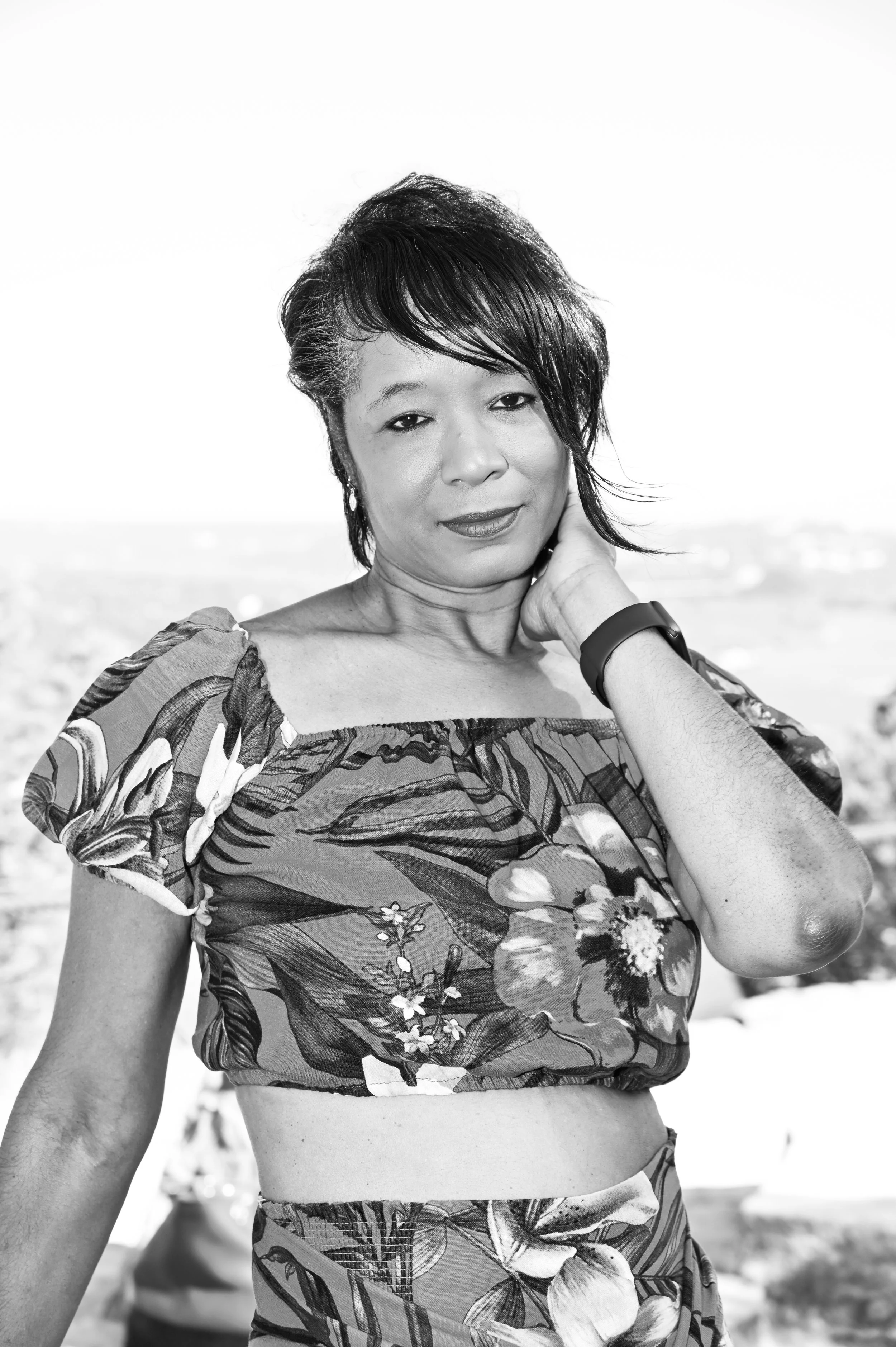 A timeless black and white portrait photographed at one of Austin’s scenic overlooks. With the Texas landscape softly fading into the background, the focus shifts entirely to expression, posture, and personality. Caerus Multimedia often uses monochro