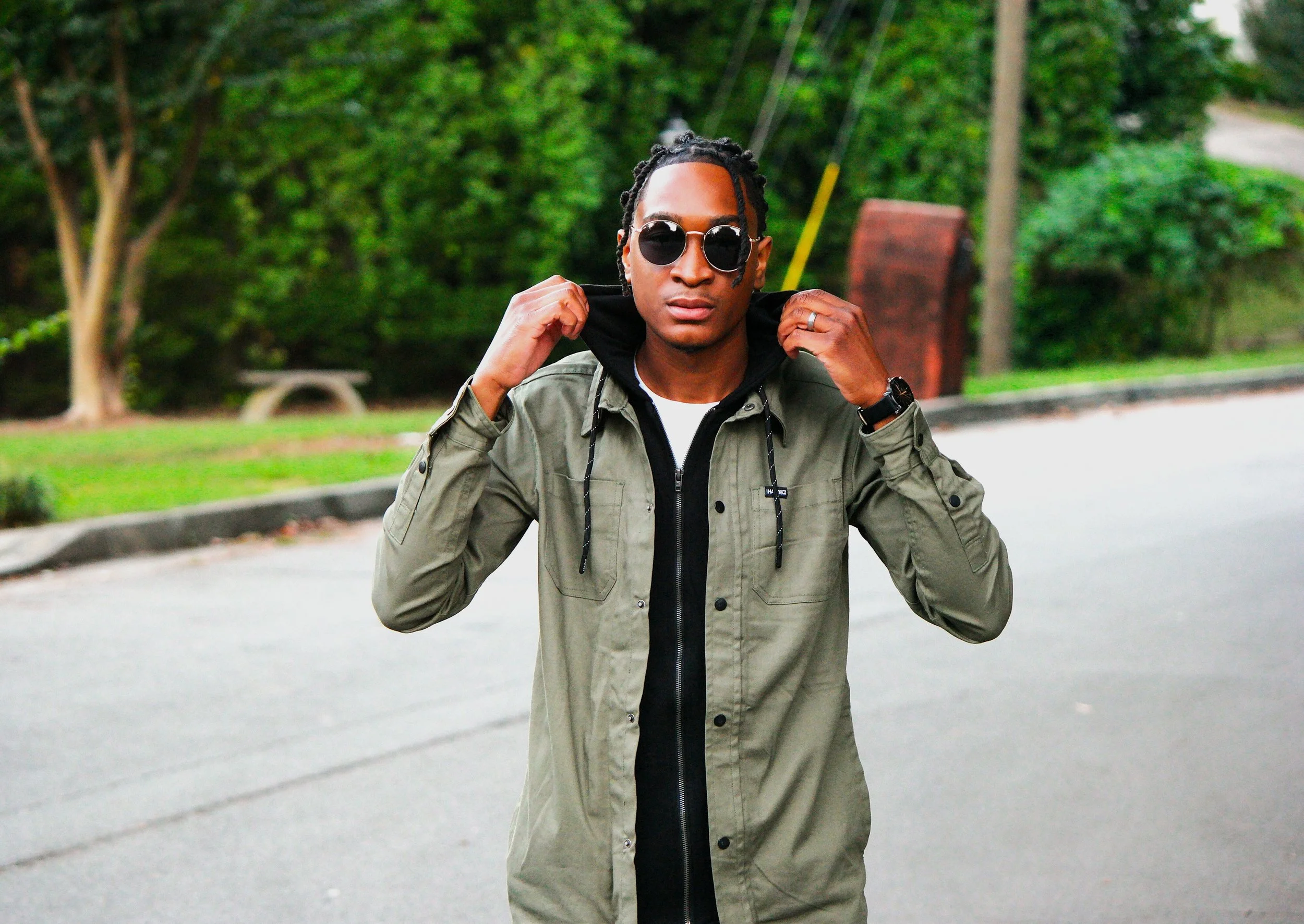 An outdoor portrait session photographed on location in Atlanta, Georgia. The centered composition and subtle urban background highlight the subject’s style while maintaining a natural, lifestyle portrait feel.