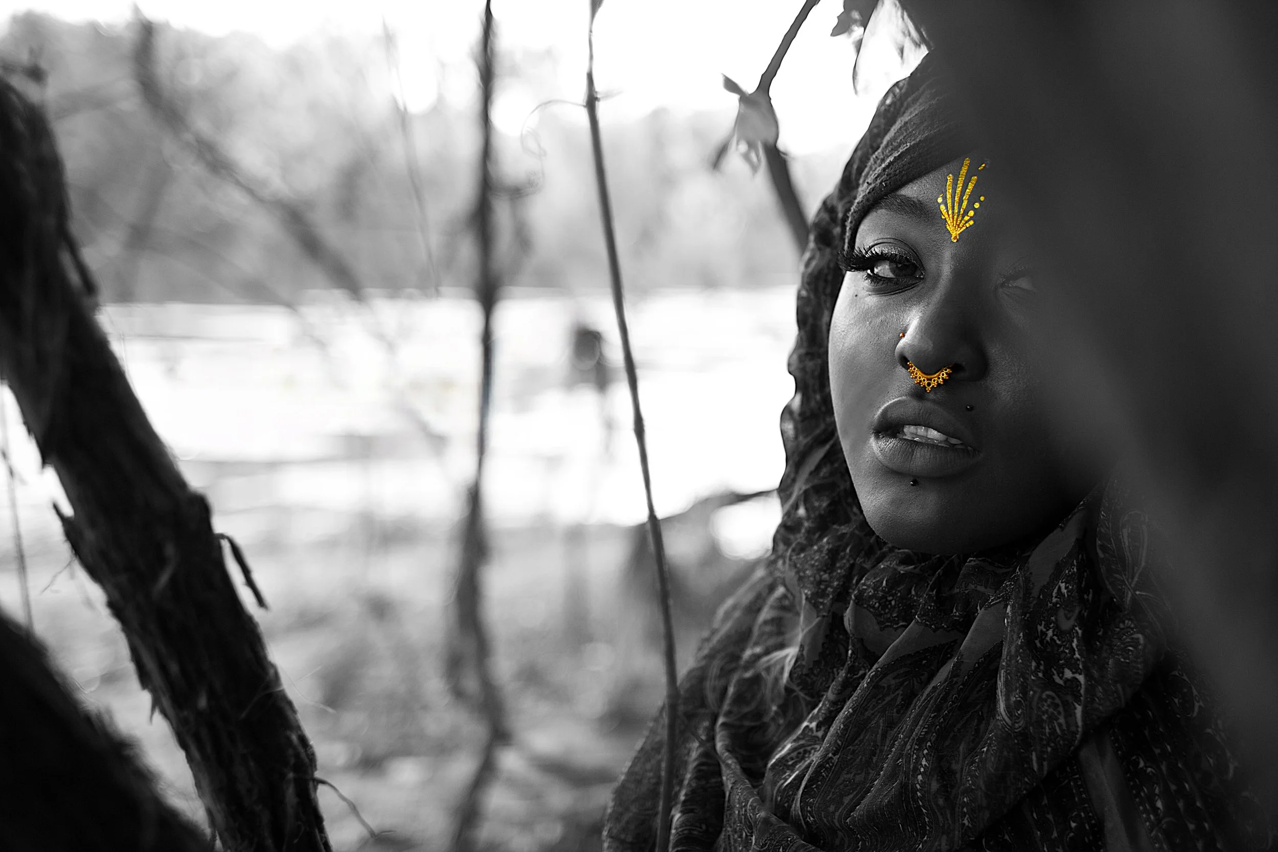 Rendered in striking monochrome with golden accents, this portrait highlights the symbolic markings of the Queen. The contrast between shadow and light reflects the duality of strength and serenity within the Queen of the Golden Sun series.