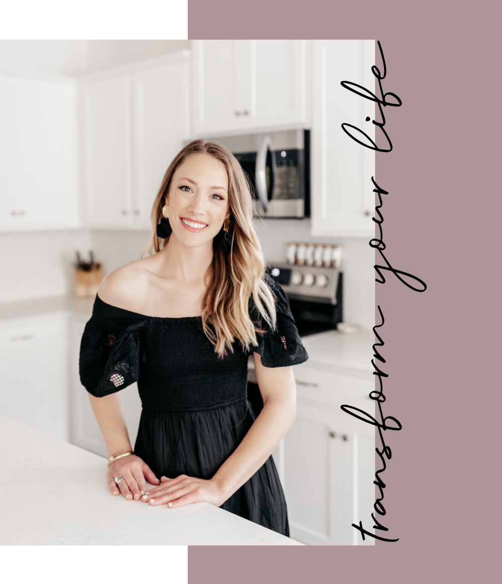 A woman with long blonde hair smiling in a black off-shoulder dress, standing in a modern kitchen with white cabinets and stainless steel appliances. Text on the image reads 'thank you so much' in cursive.
