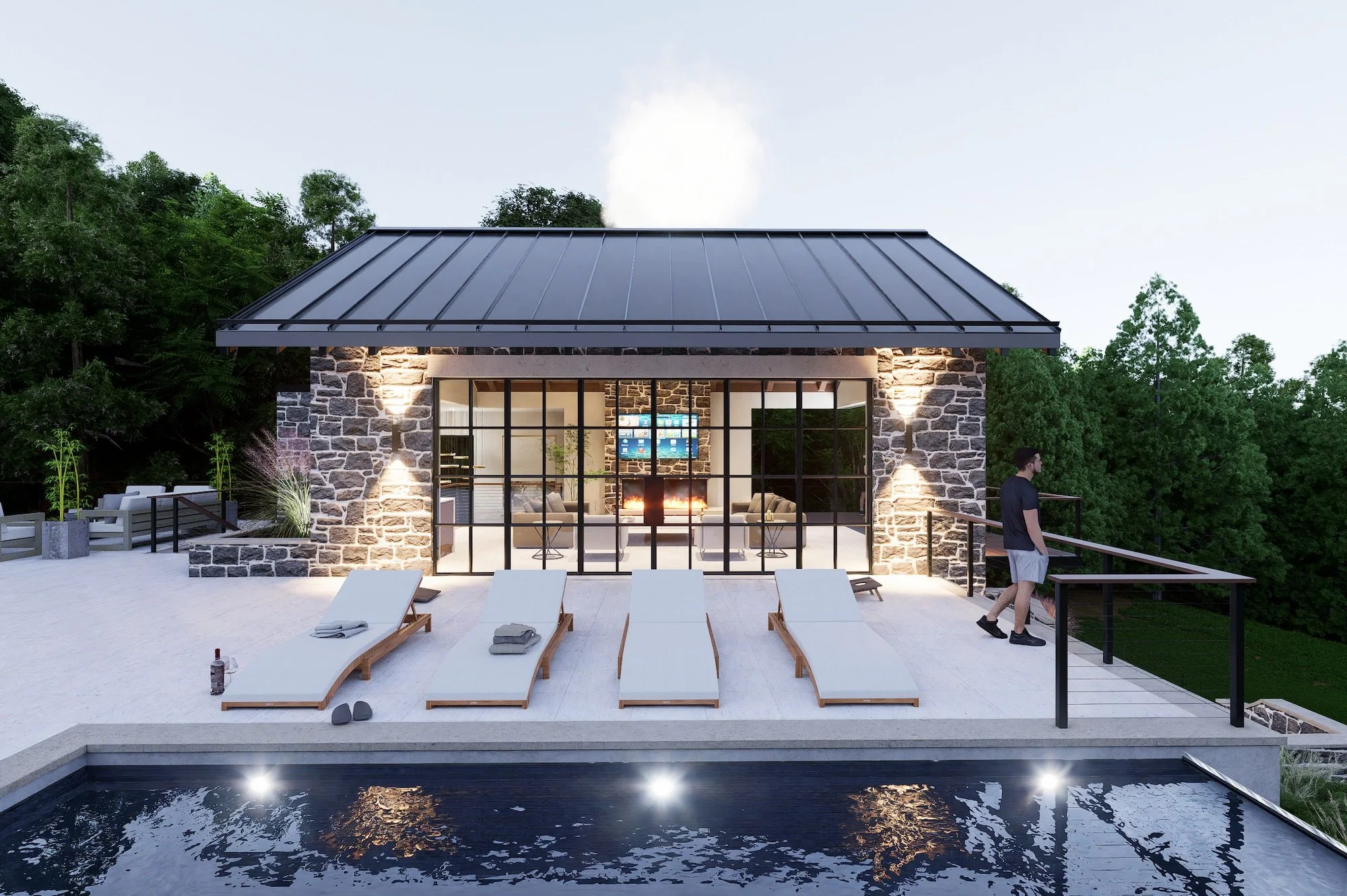 Modern pool house with stone walls, large glass doors, outdoor pool, and poolside lounge chairs, surrounded by trees at dusk.