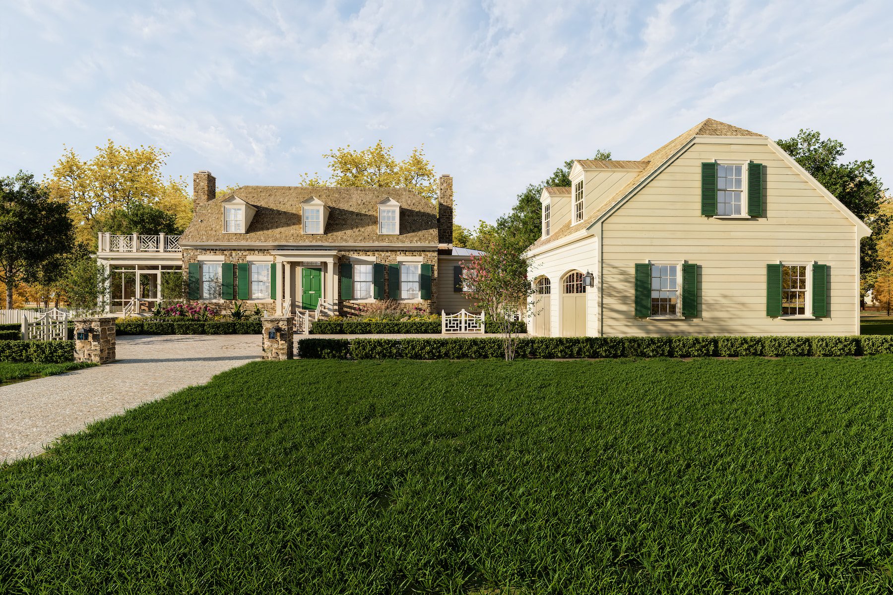 A large house with a stone and wood exterior, surrounded by a green lawn and a stone fence, with a driveway in front and trees in the background.