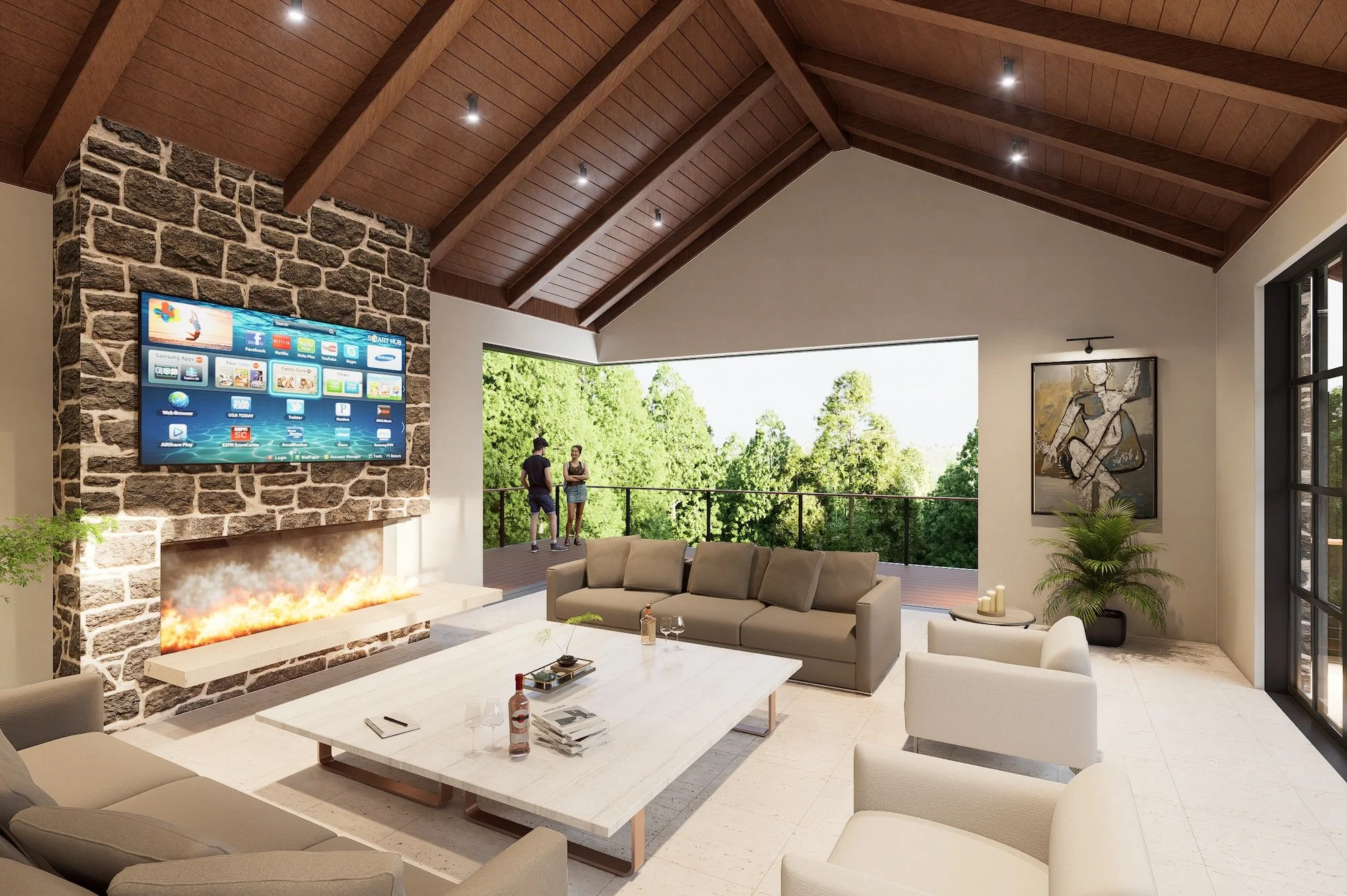 Modern living room with stone fireplace, large beige sectional sofa, white armchairs, and a coffee table with drinks. A flat-screen TV is mounted on a stone wall above the fireplace. An open balcony shows two people talking, surrounded by greenery. The room has a high wooden ceiling, artwork on the wall, and multiple candles and plants for decor.