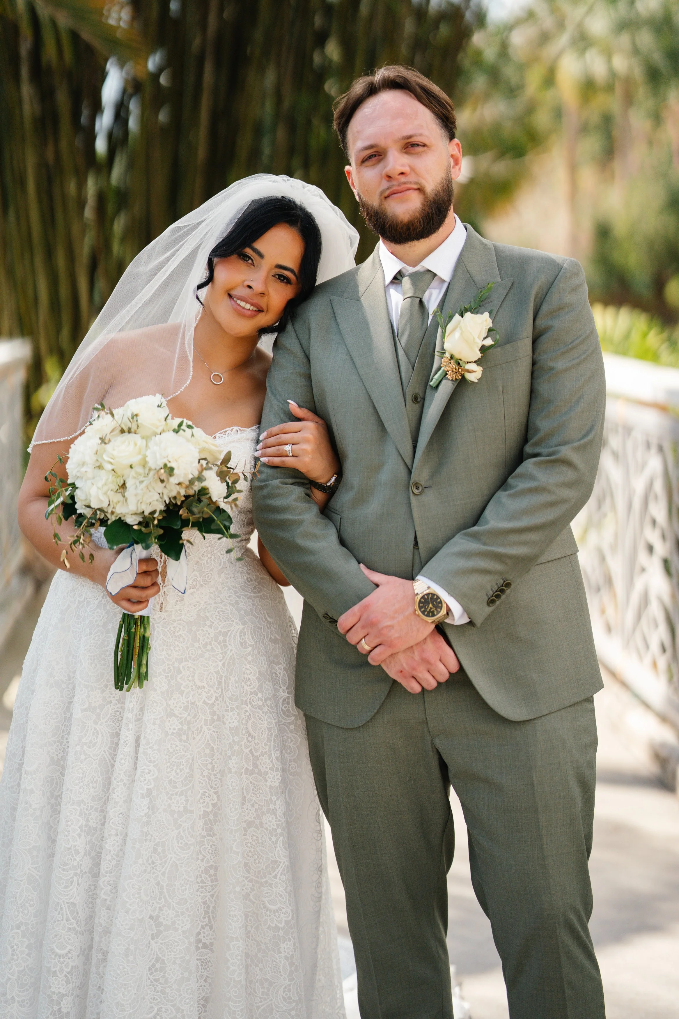Bride and groom portrait together after ceremony in South Florida with natural light and soft greenery