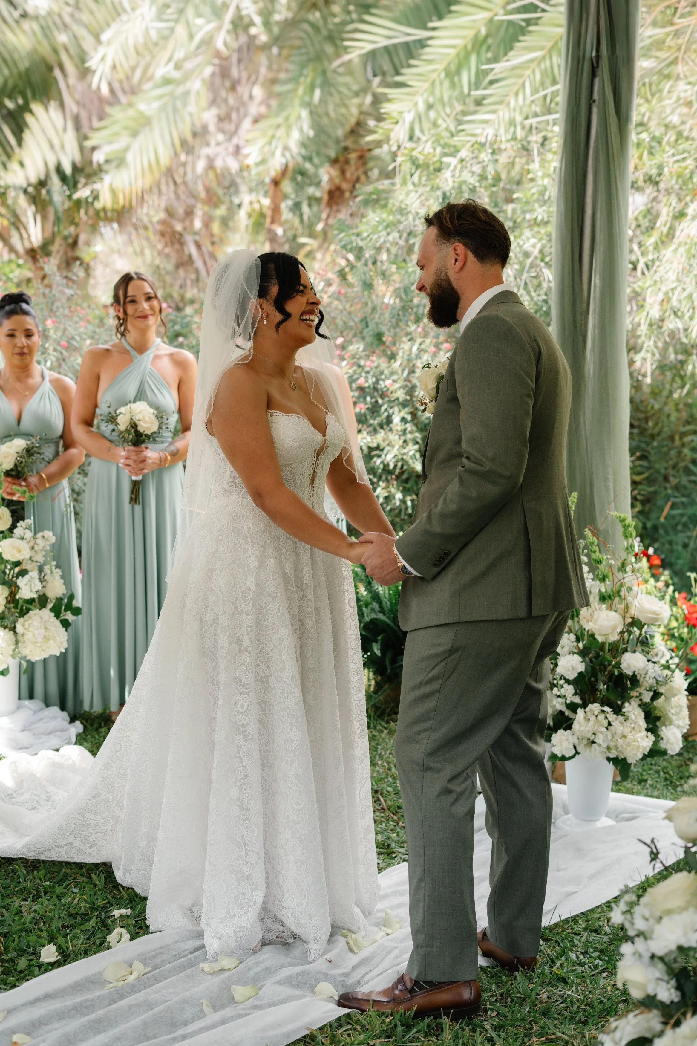 Wedding ceremony moment with bride and groom exchanging vows in South Florida outdoor setting
