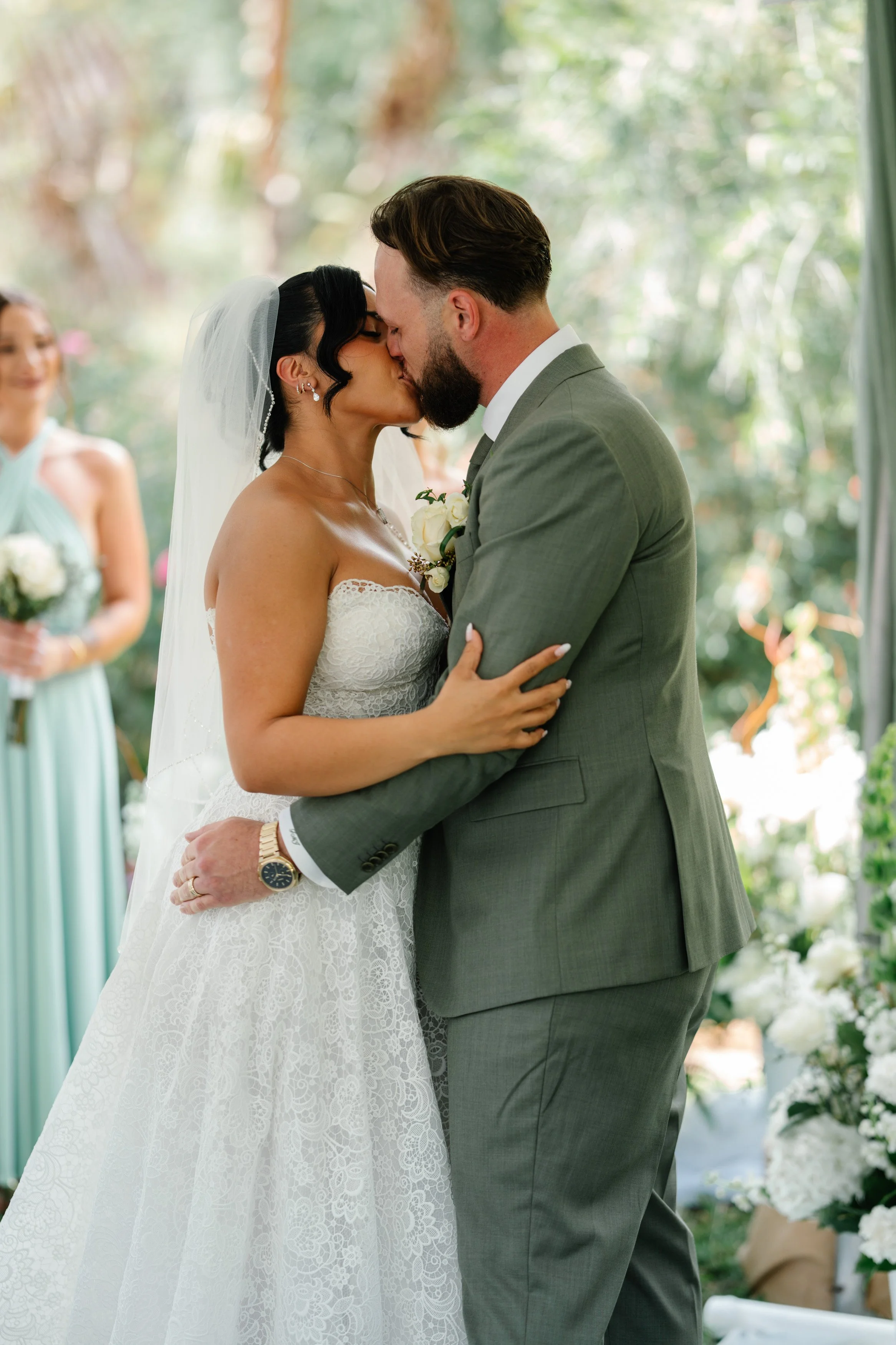 Wedding ceremony moment with bride and groom exchanging vows in South Florida outdoor setting