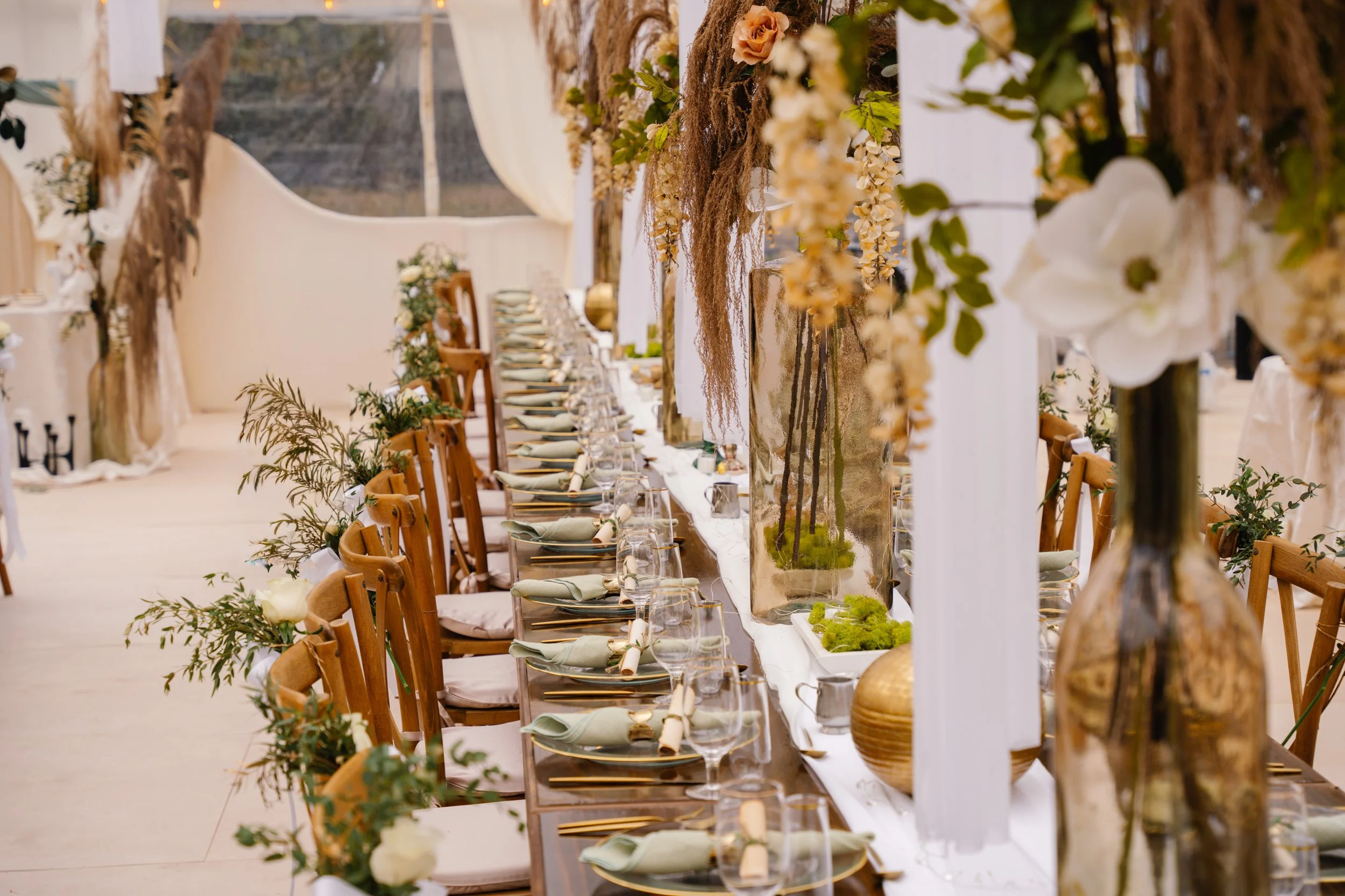 Wedding reception aisle with chairs and floral decor in outdoor South Florida venue setting