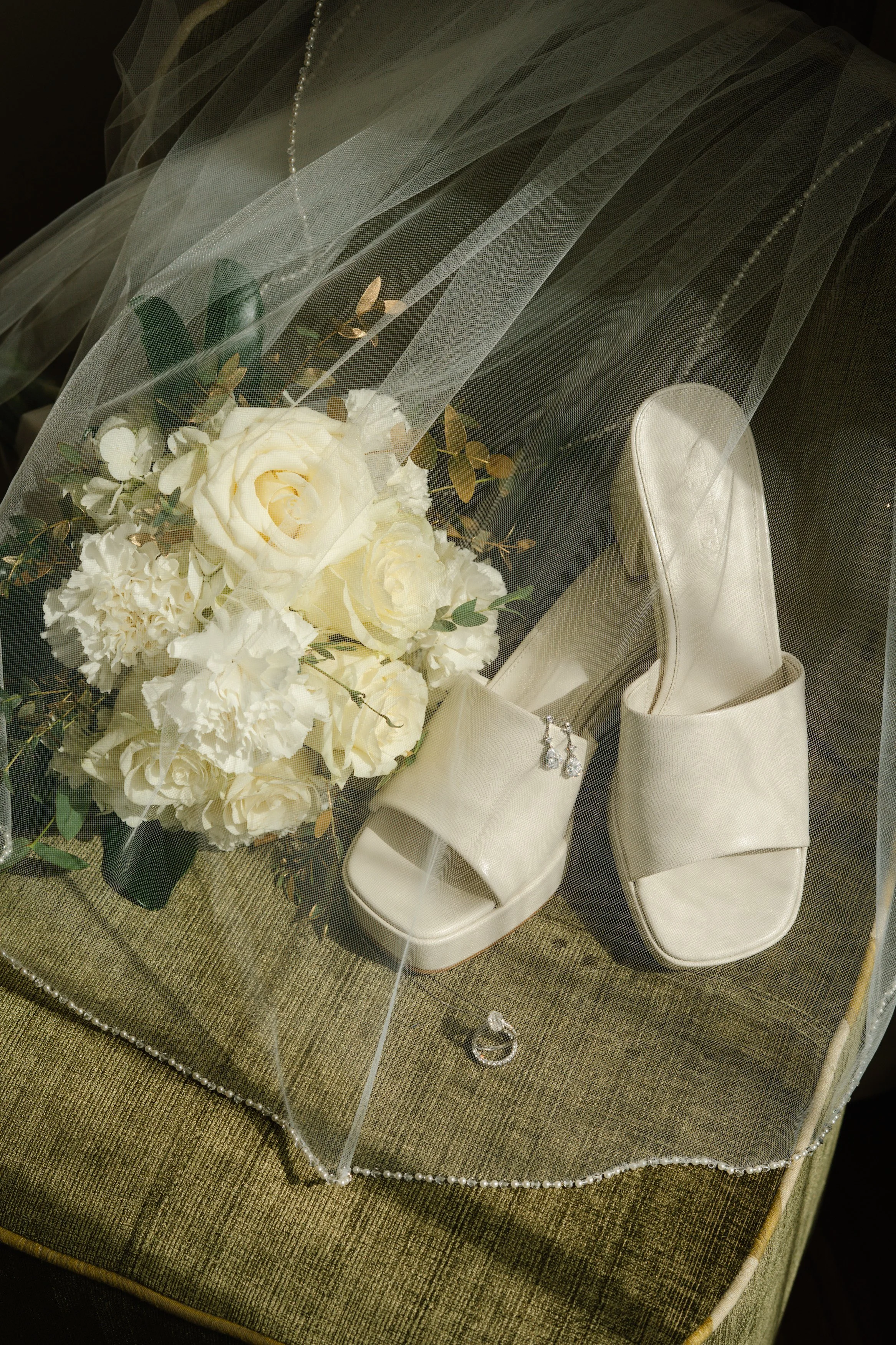 Bridal details with white heels and bouquet styled for a South Florida wedding morning