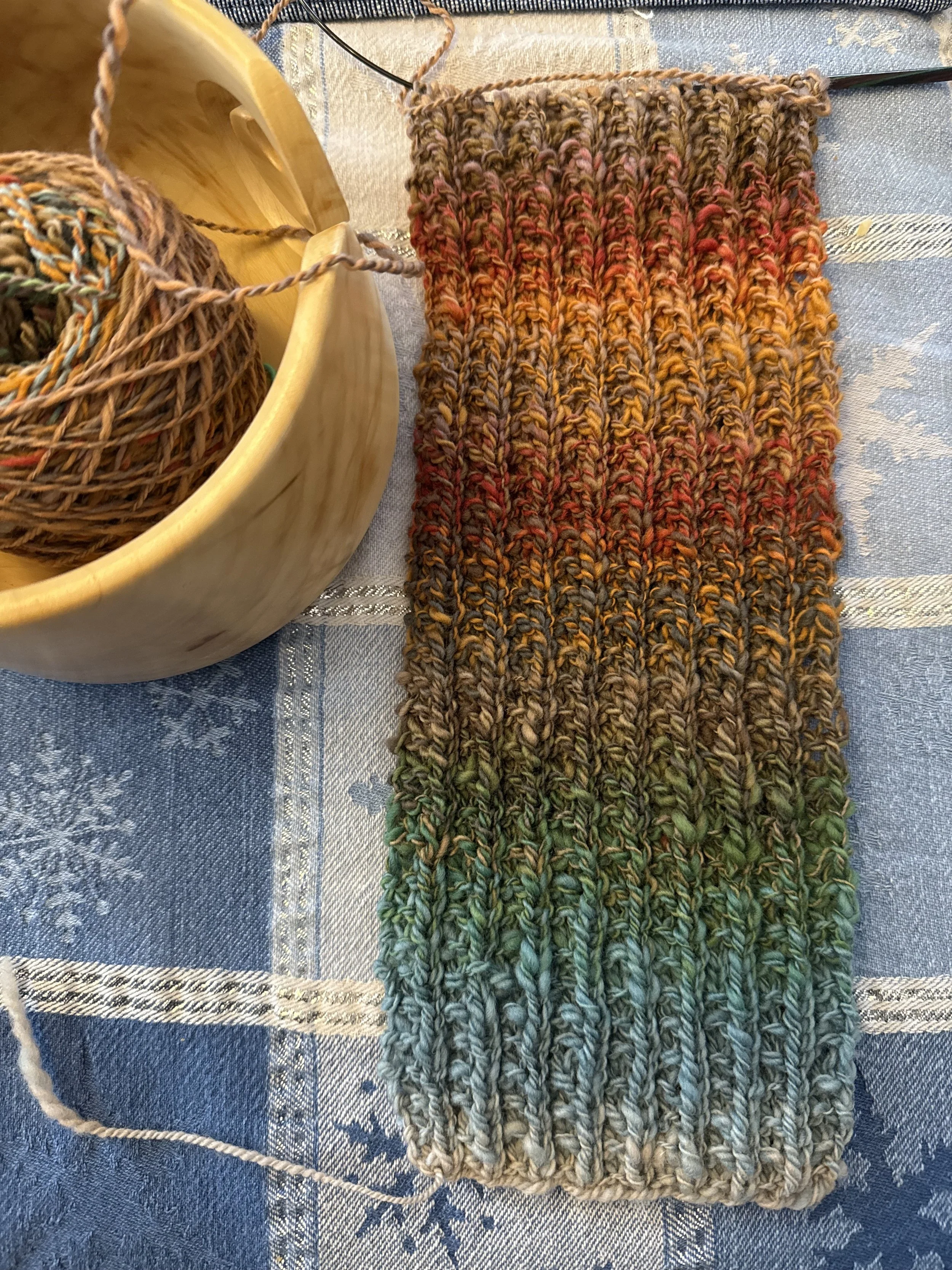 Wool spun into yarn and knit into a scarf by me!