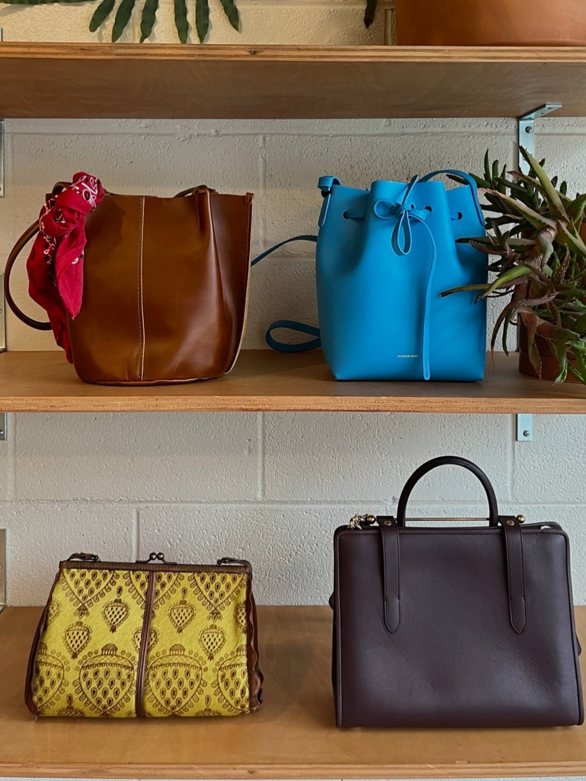 Now in the shop: cute bags!
(Starting top left)
- Portland Leather Goods Almost Perfect Devan bucket tote
- Mansur Gabriel bright blue mini bucket bag
- Vintage Rare Jamin Peuch Paris medallion print shoulder bag
- Strathberry midi leather bag w/musi