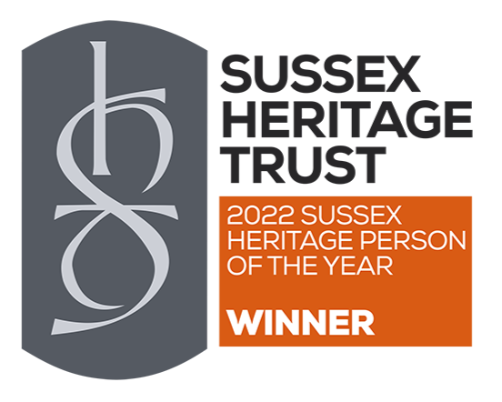 Certificate from Sussex Heritage recognizing an individual as the 2022 Sussex Heritage Person of the Year, with the word 'WINNER' displayed in bold on an orange background.