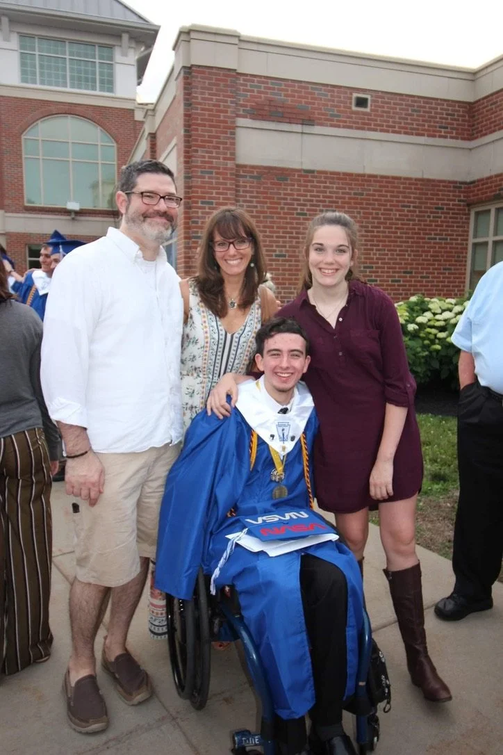 Rebecca and her family at her son's high school graduation.