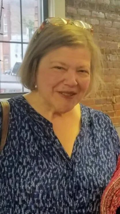 an older woman is smiling