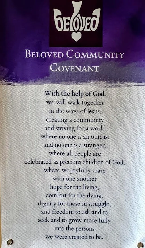 a piece of paper with Beloved Community Covenant written at the top and several lines of text are written beneath