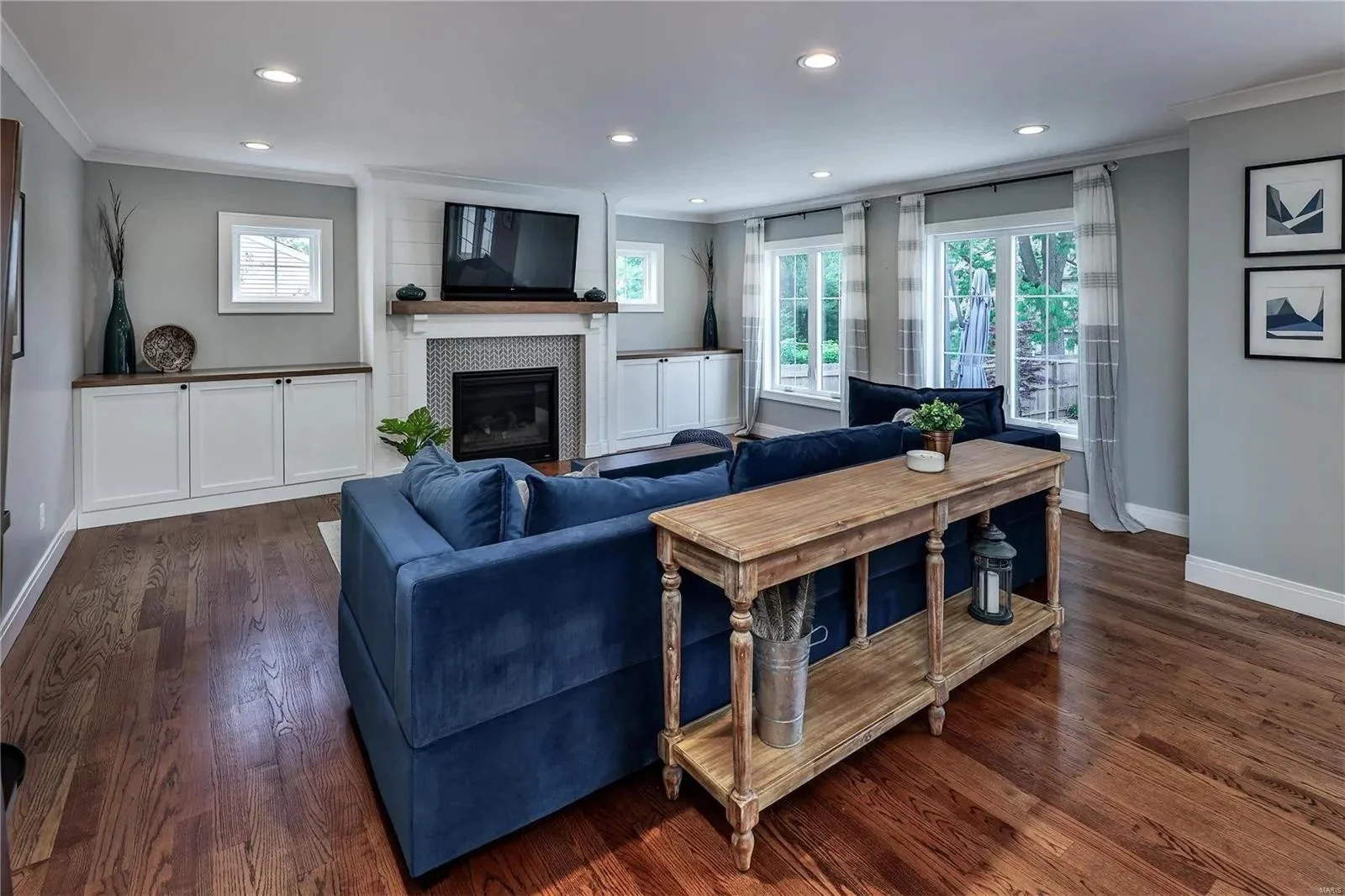 Fireplace wall with built-in cabinets