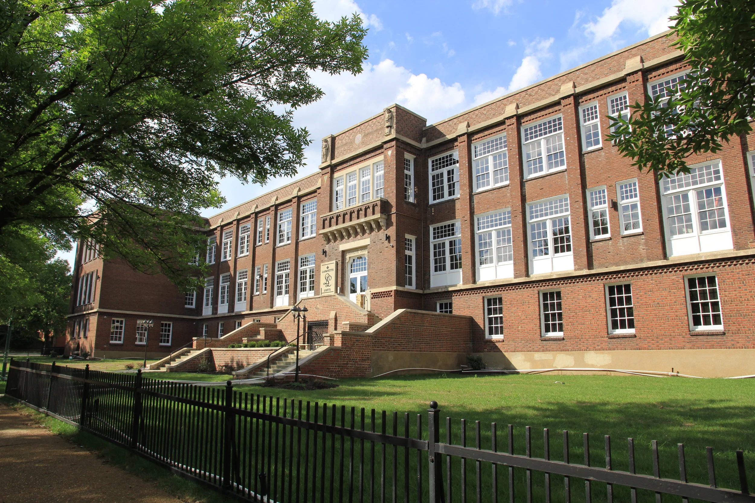 Brick school building with classical architectural features