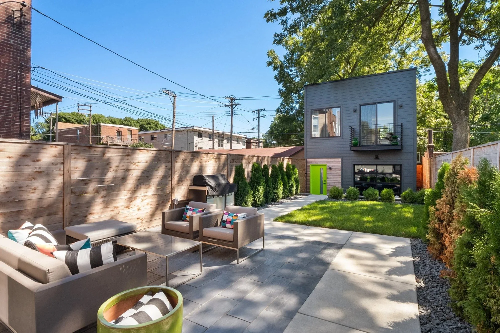 Courtyard patio with outdoor seating and lawn
