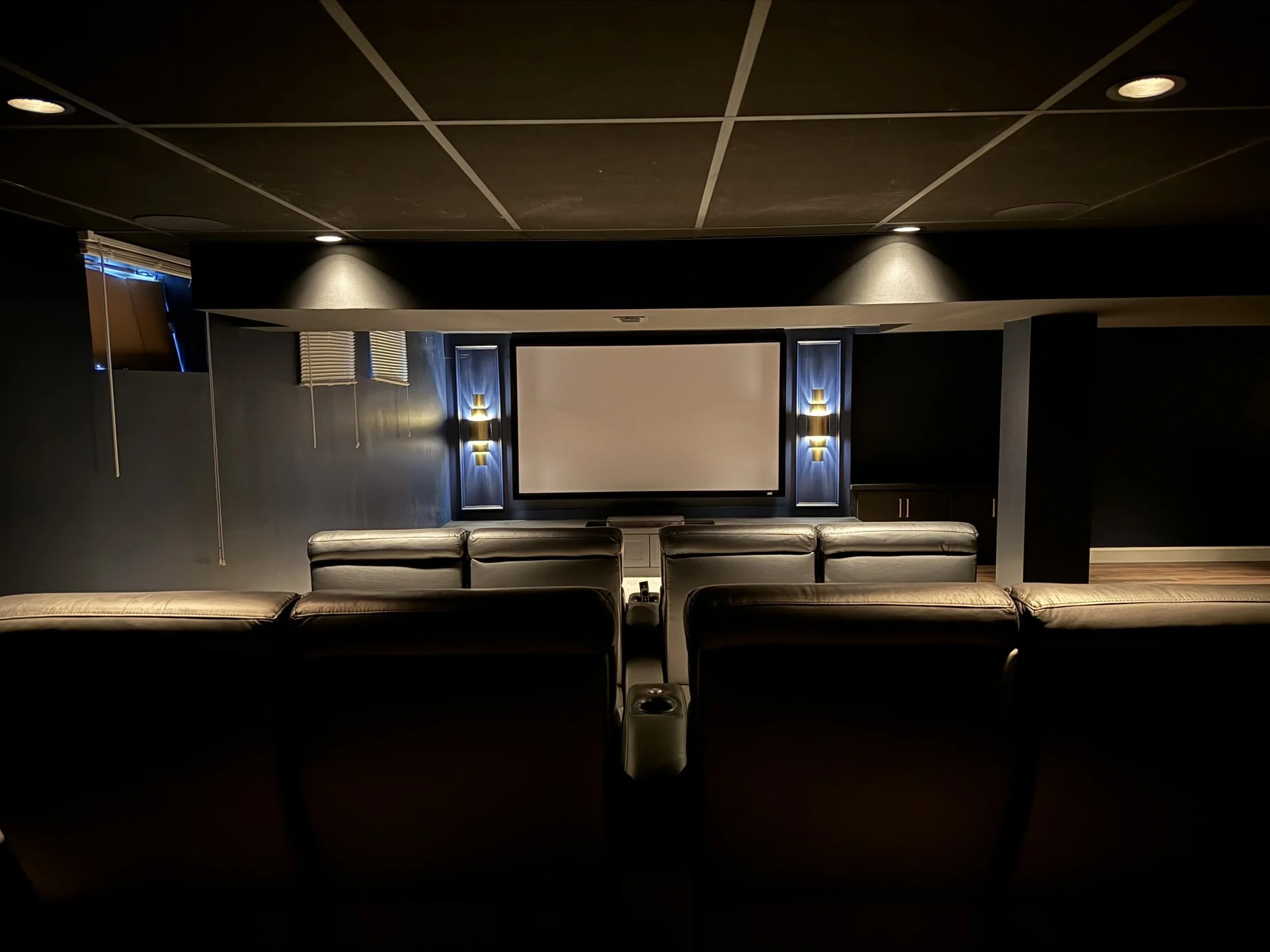 Theater seating facing a projection screen