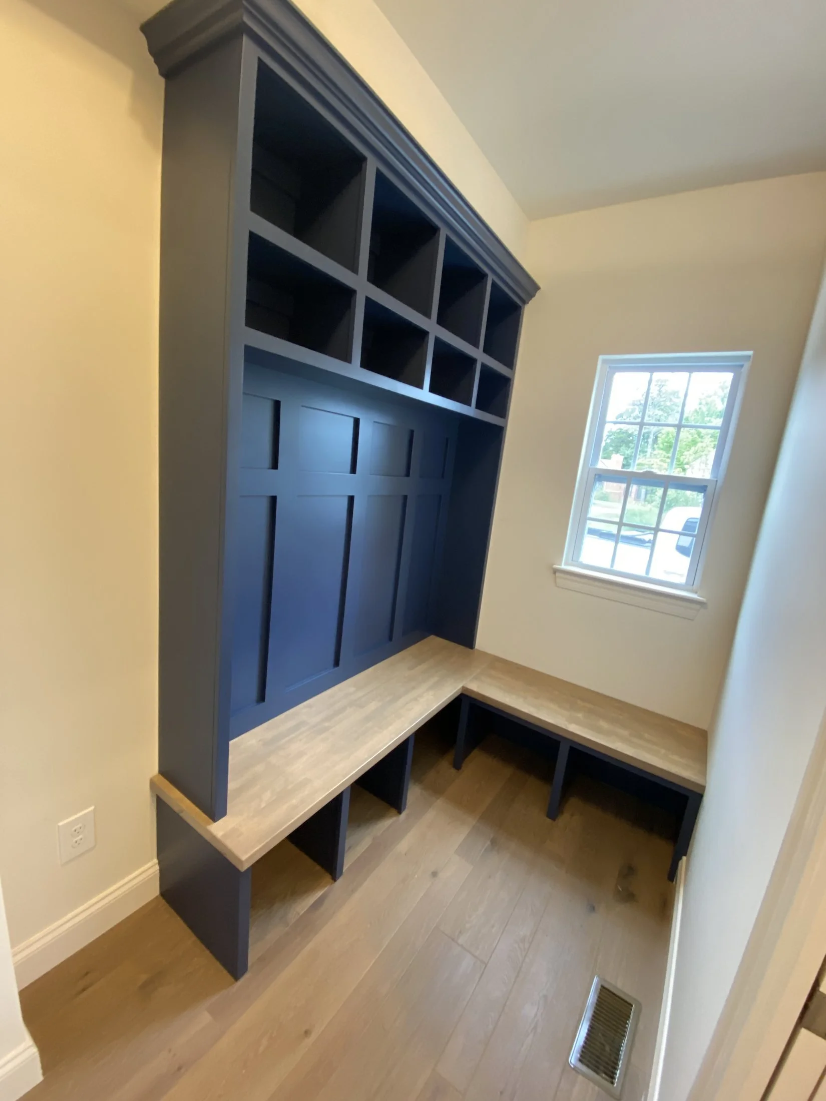 Built-in navy lockers with board-and-batten backs
