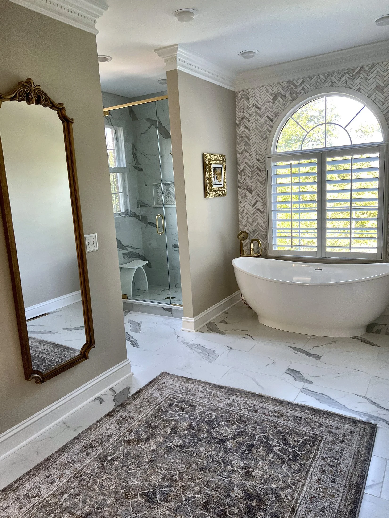Tub and arched window seen from the doorway
