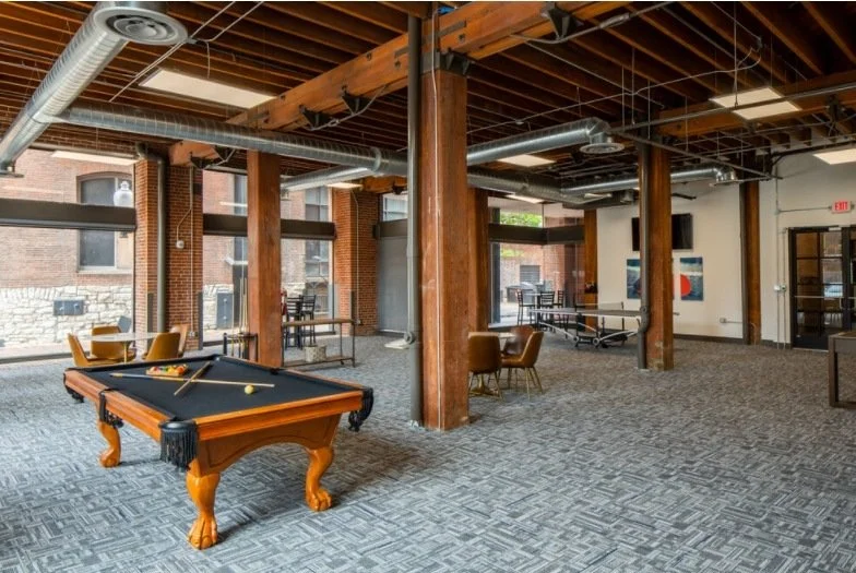 Billiards lounge under exposed ductwork
