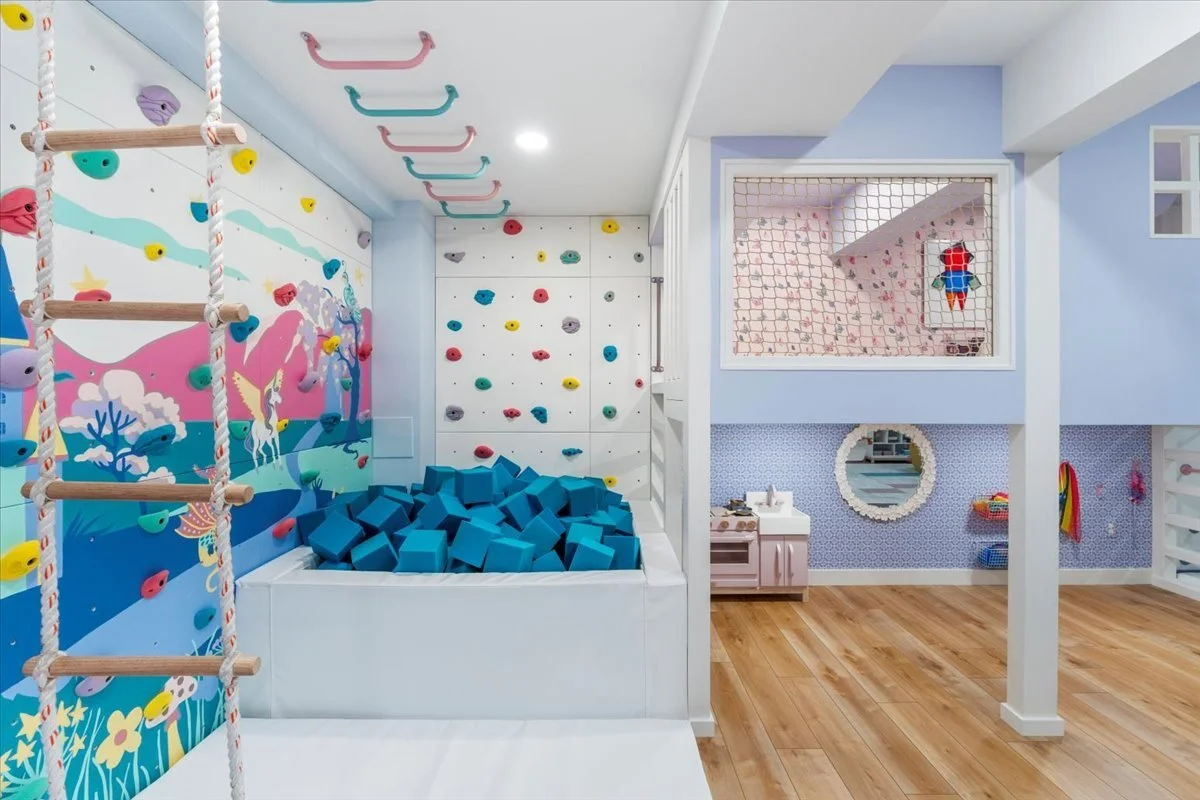 Climbing holds and a foam pit