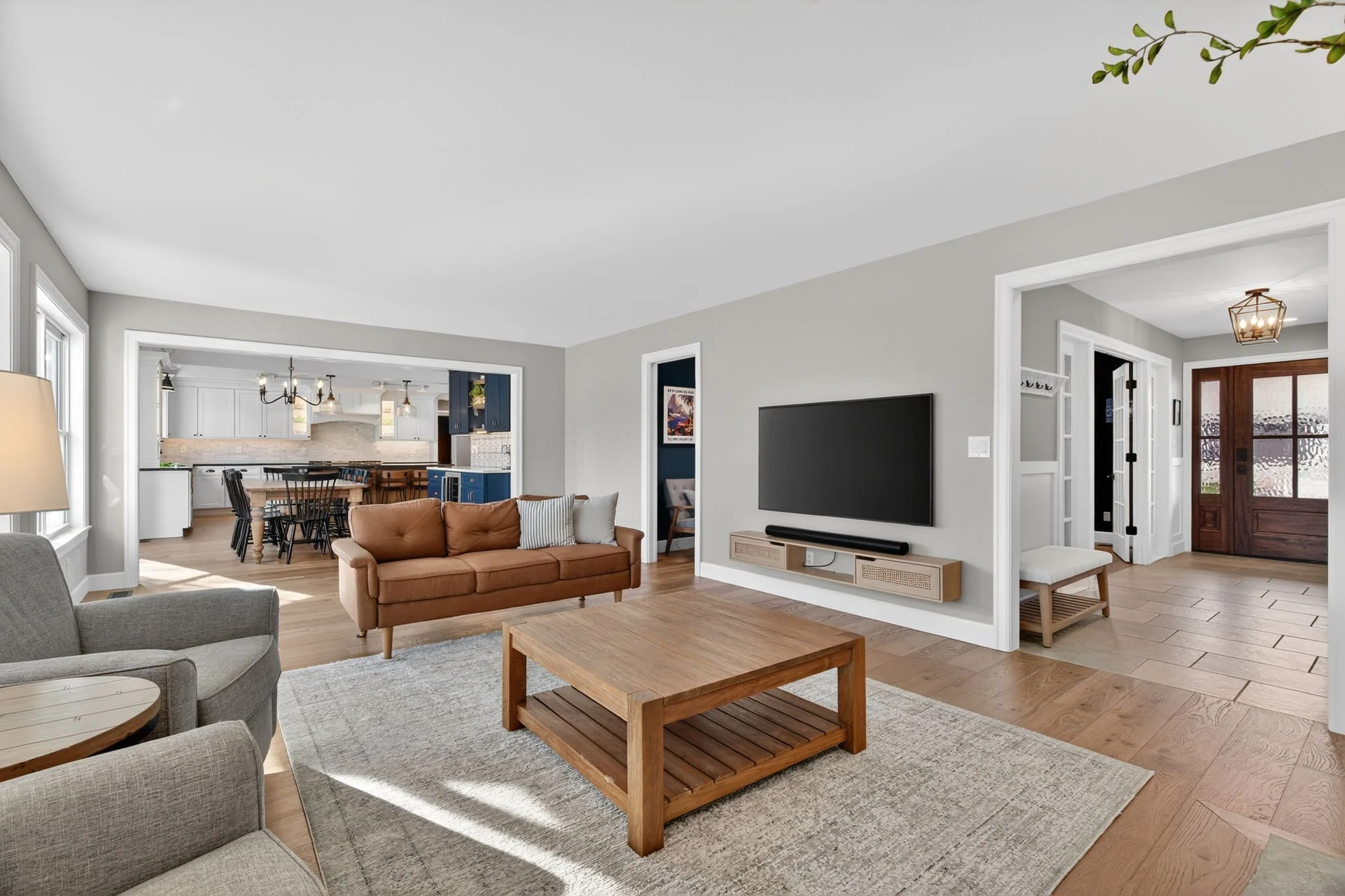 Family room with views to the kitchen and front entry