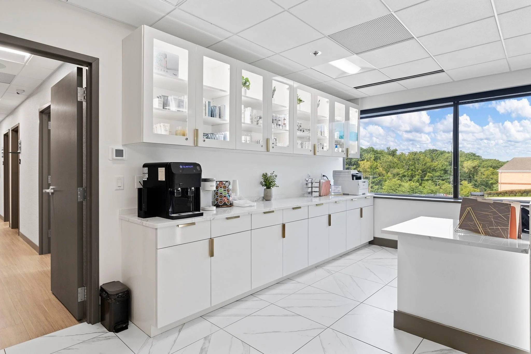 Built-in coffee bar cabinetry by the windows